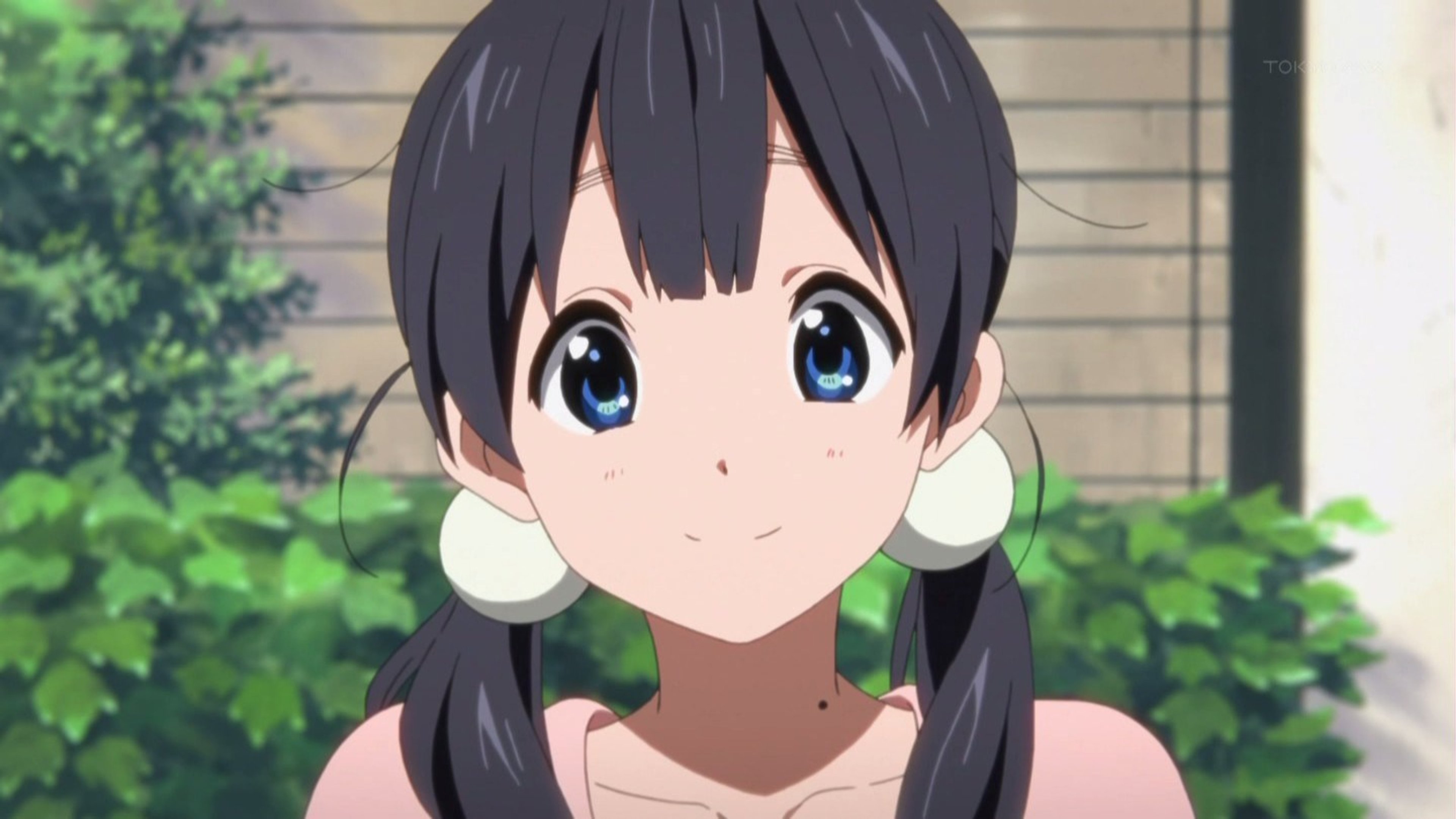An anime-style character of a friendly, cheerful high school girl with long dark hair