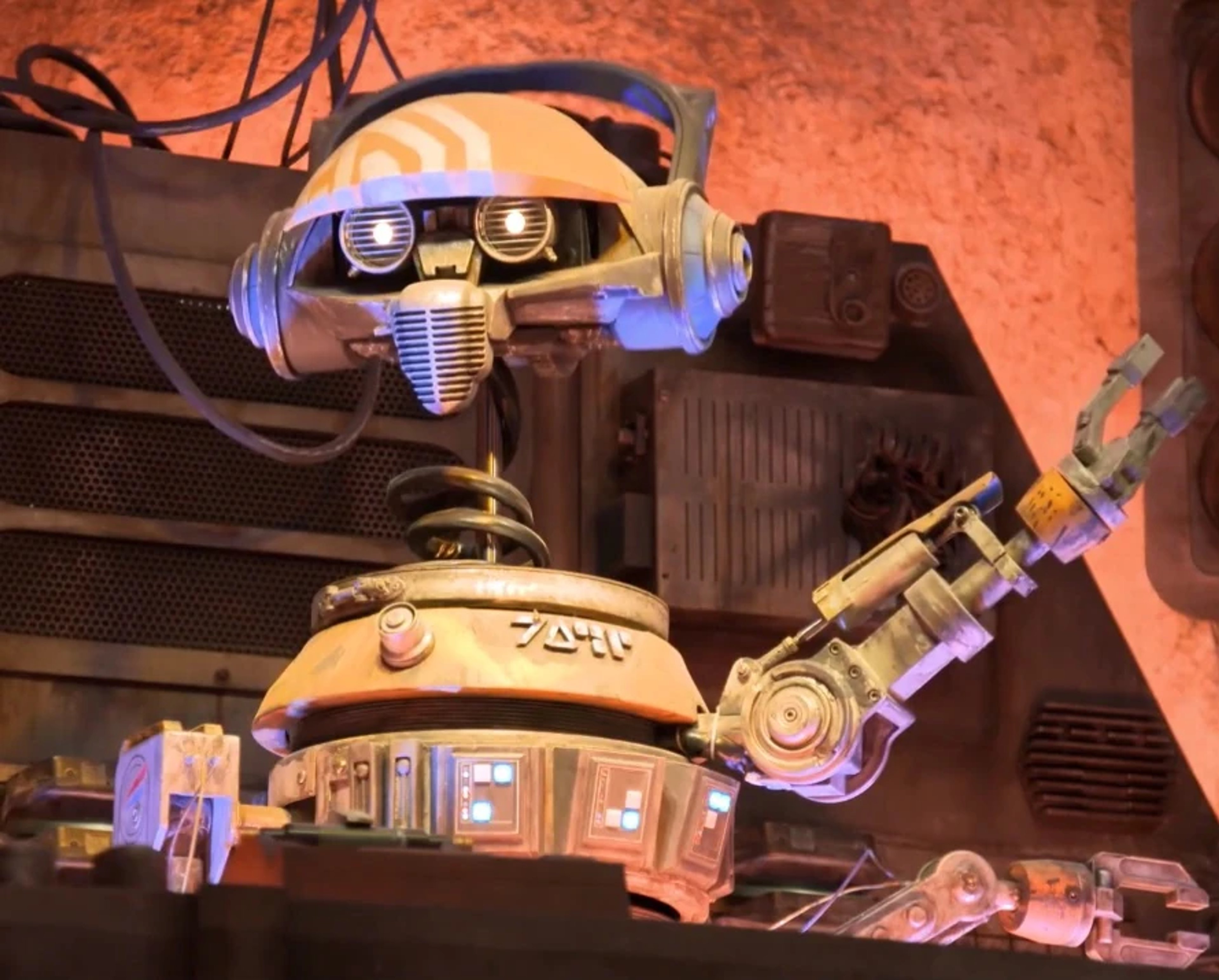 R-3X, a silver and gold droid with purple trim