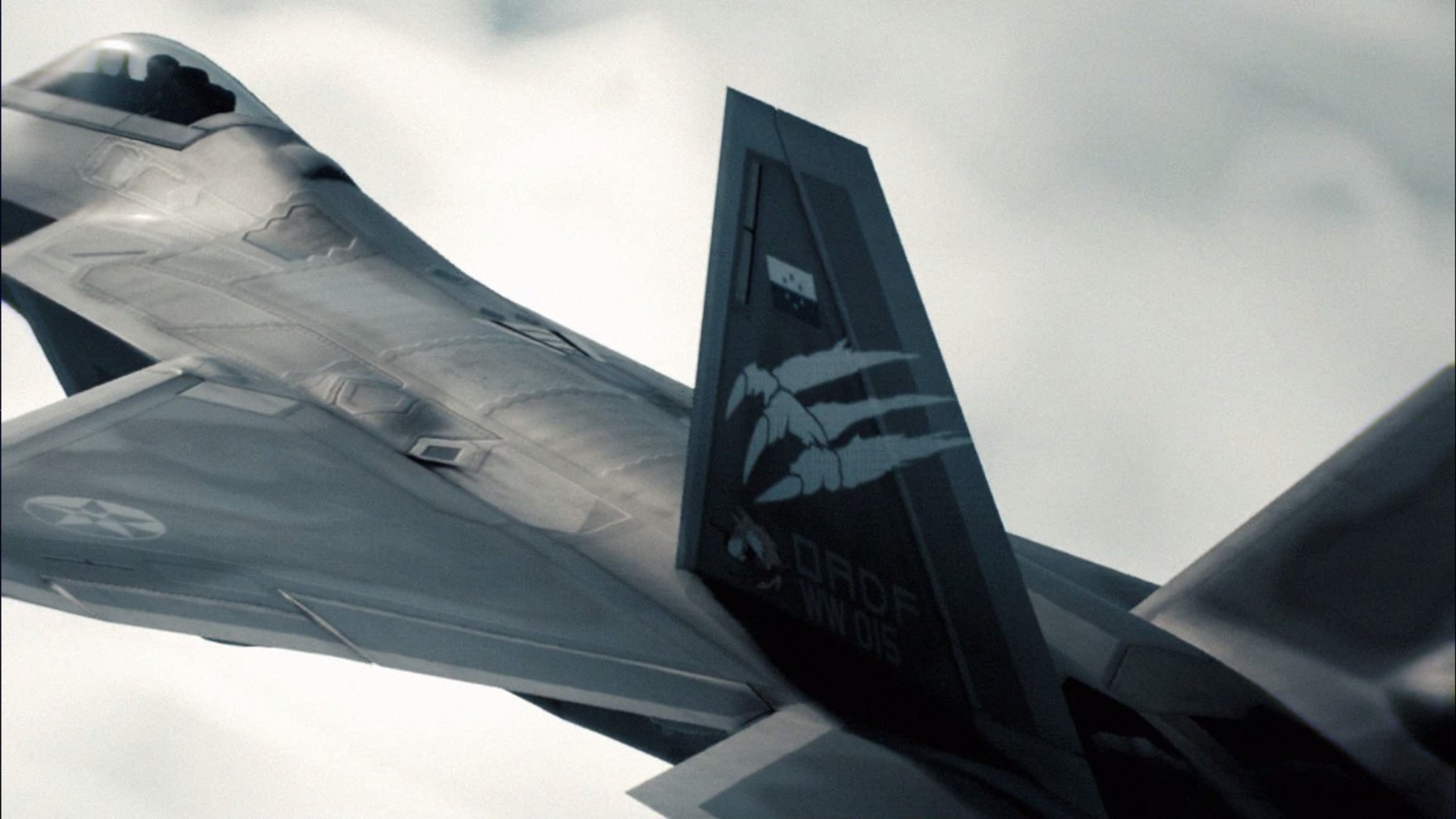 A dark, angular stealth fighter jet with swept wings