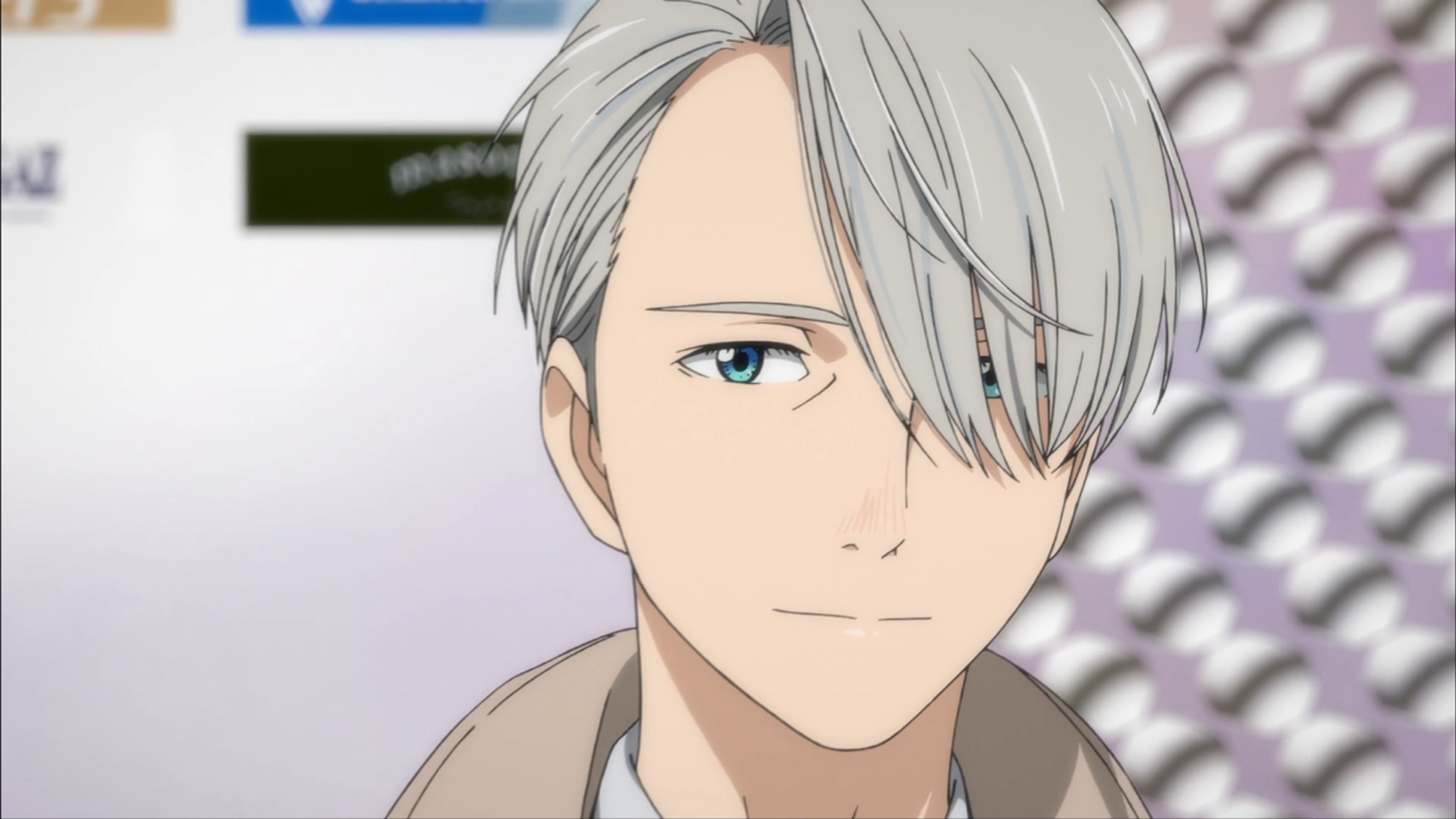 A man with silver-gray hair and blue eyes, wearing a dark-colored outfit, with a confident and charismatic expression.