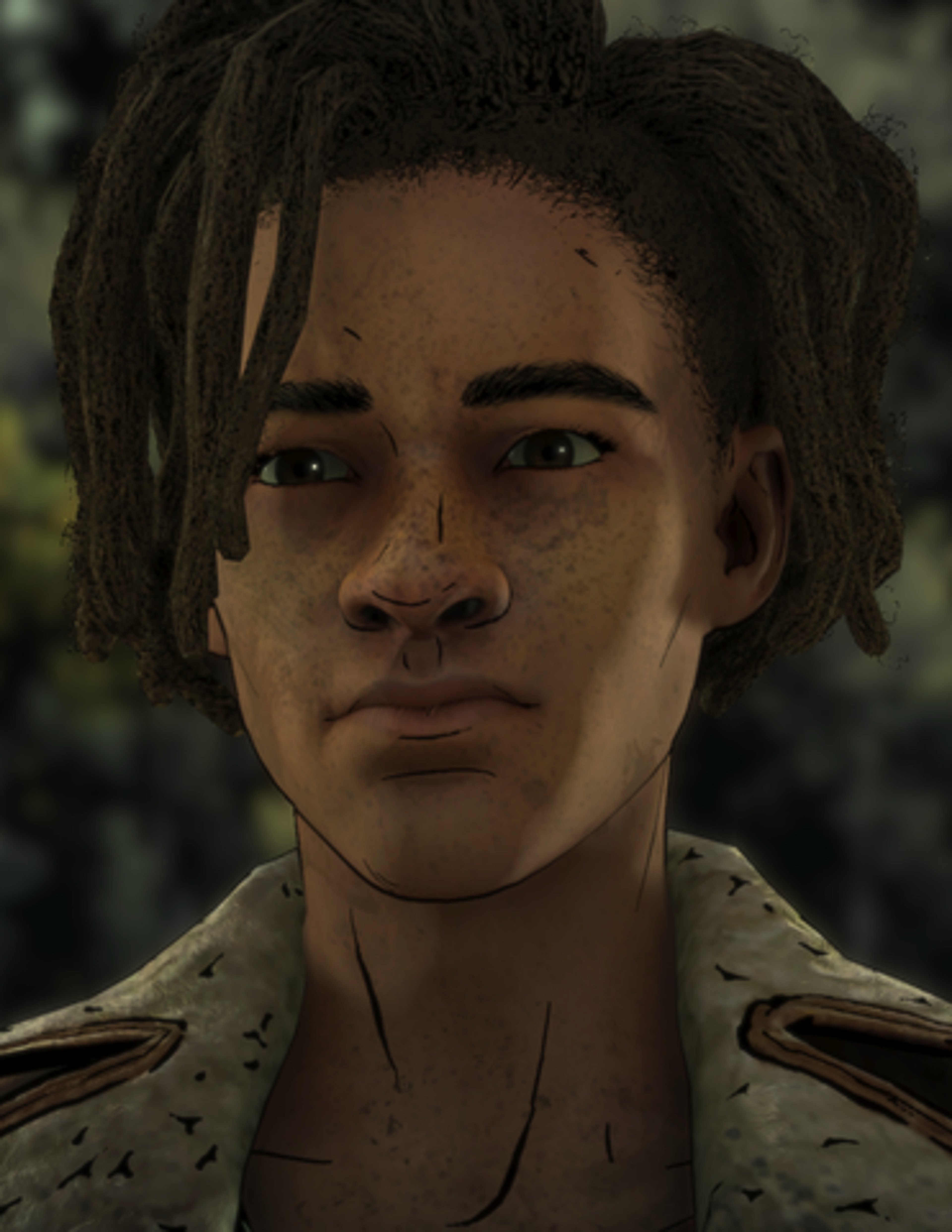 A young man with dreadlocks and a friendly expression