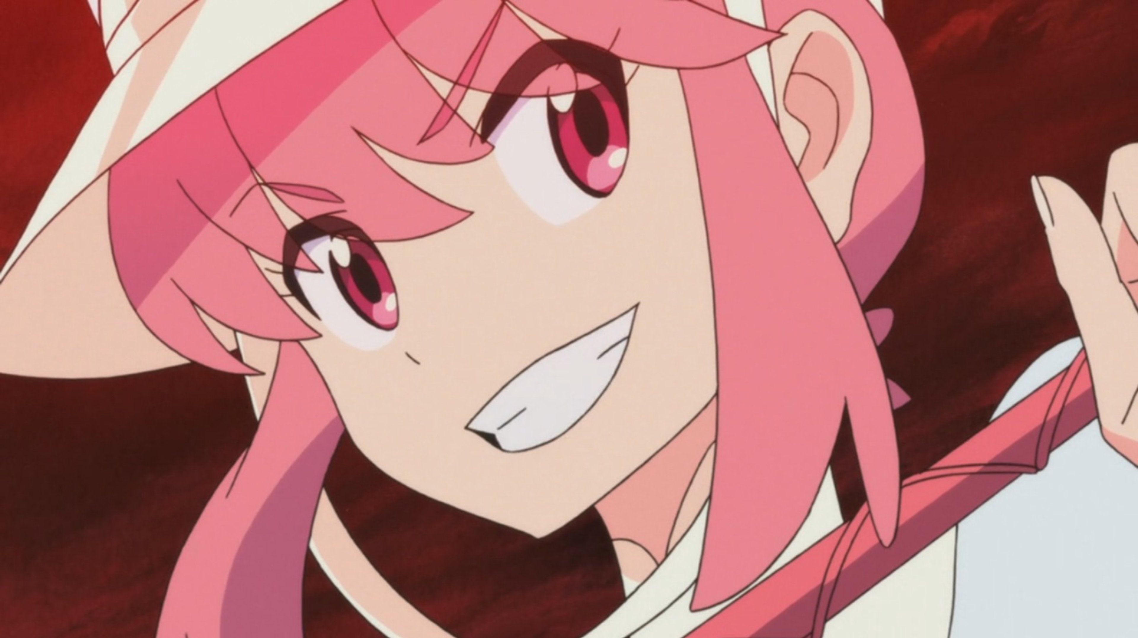 An anime character named Nonon Jakuzure with pink hair and a school uniform