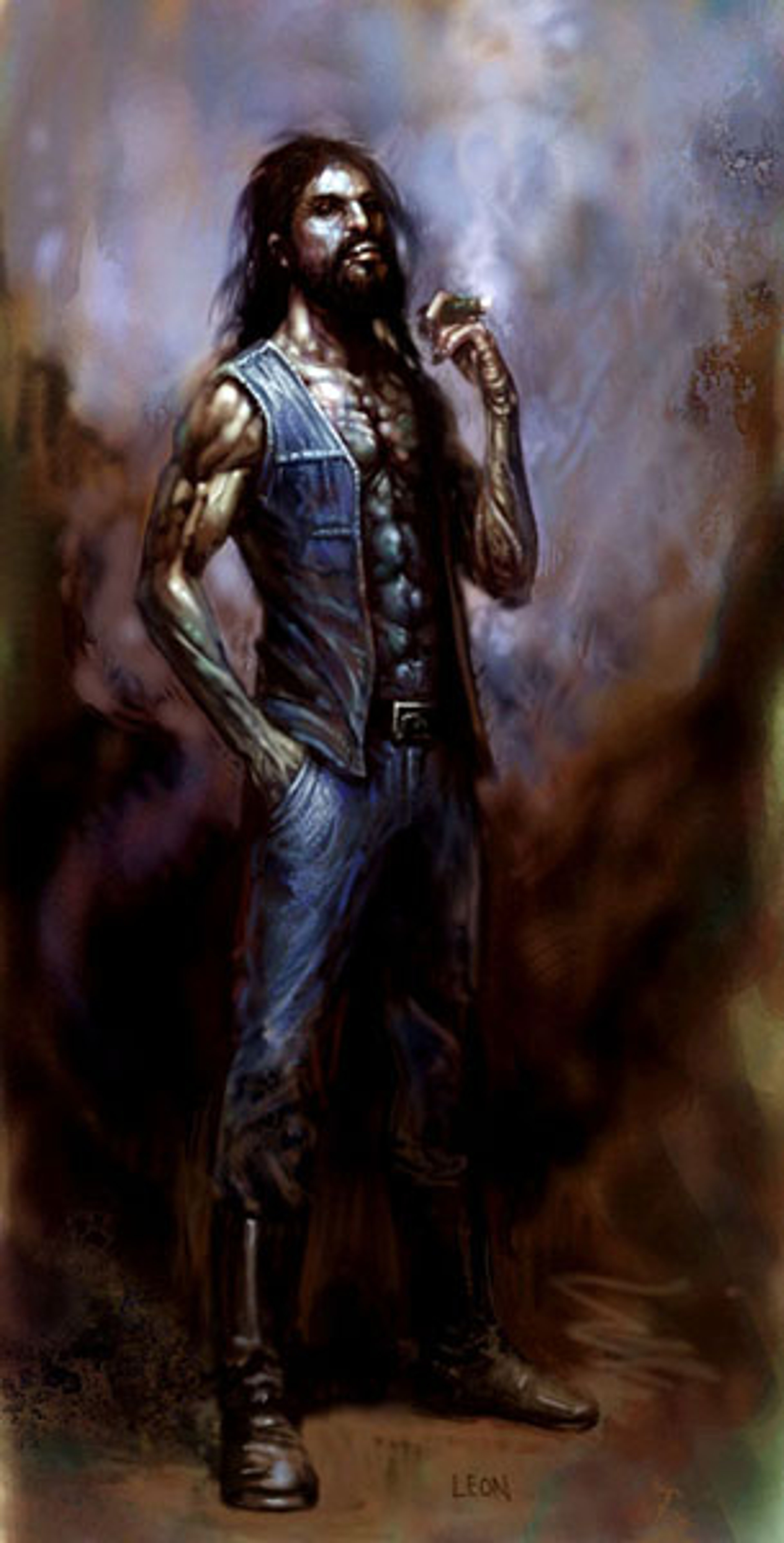 A muscular, tattooed man with long dark hair and a beard, wearing a denim vest and jeans, standing in a forested setting with a confident, defiant expression.