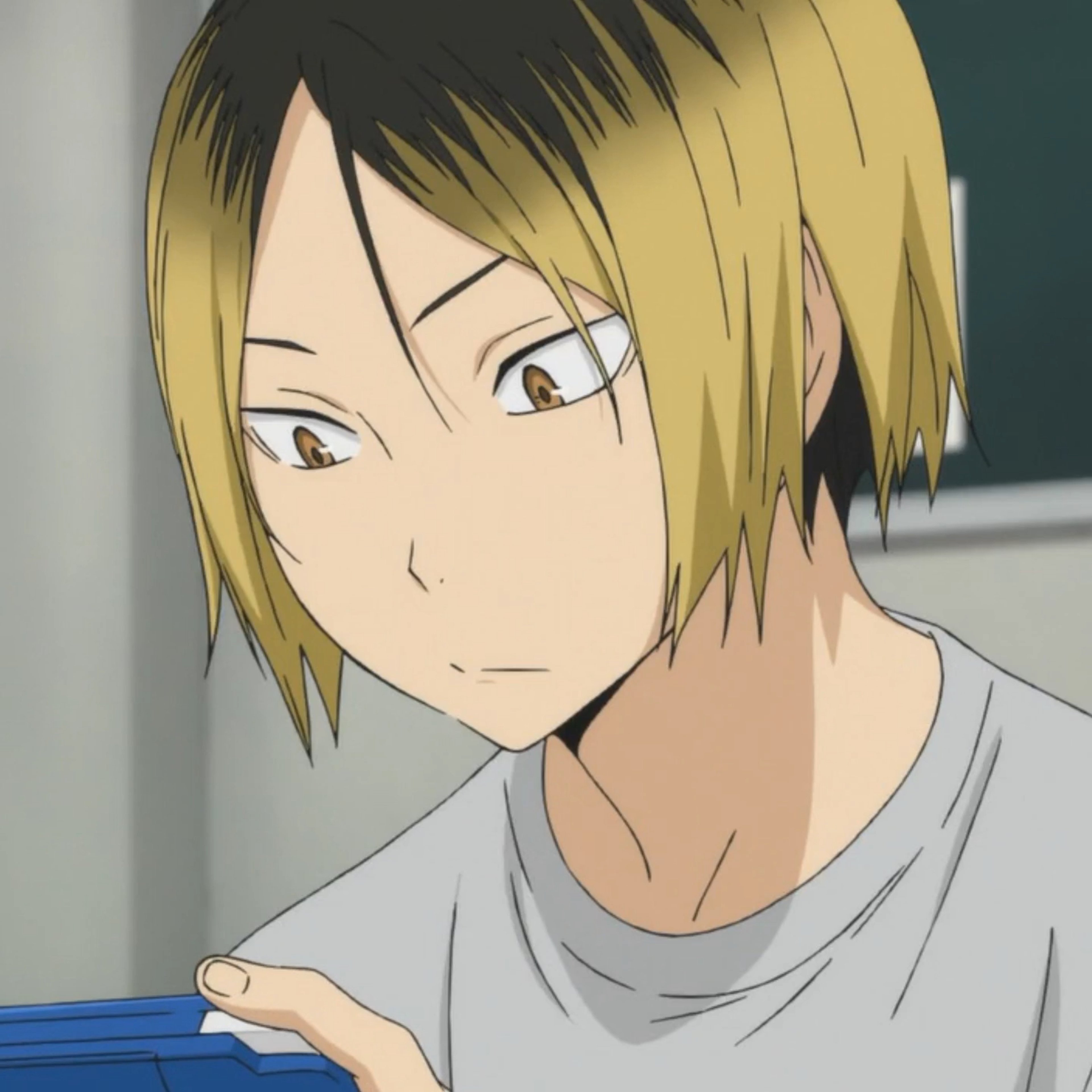 An anime-style character with blonde and black hair, wearing a gray shirt and having a thoughtful expression.