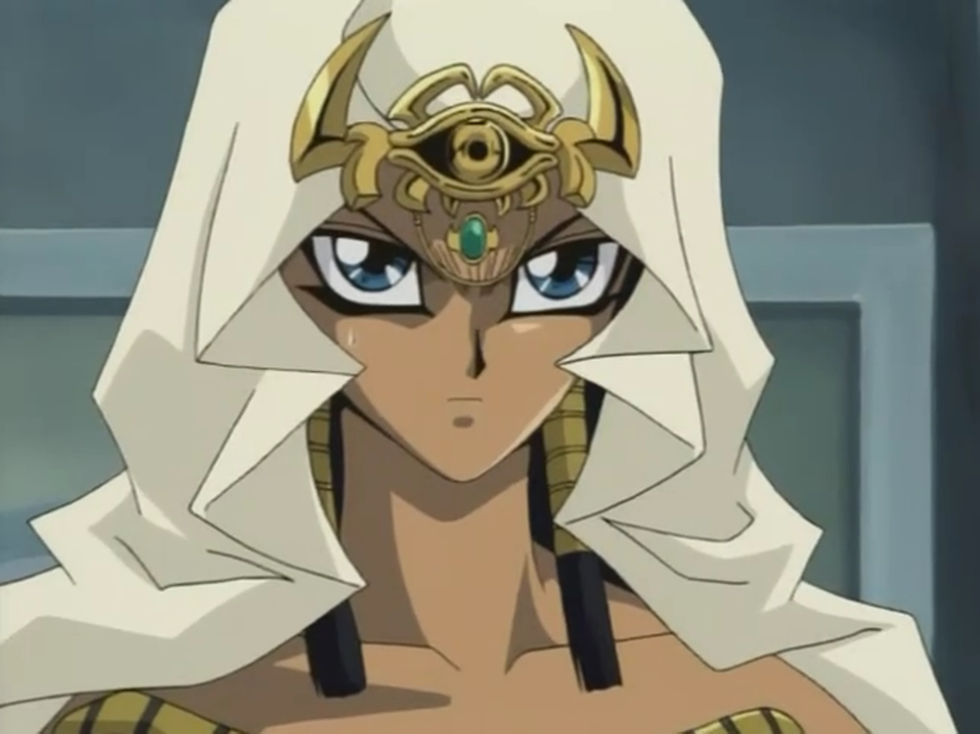 A woman with white hair and blue eyes wearing a white robe with gold accents