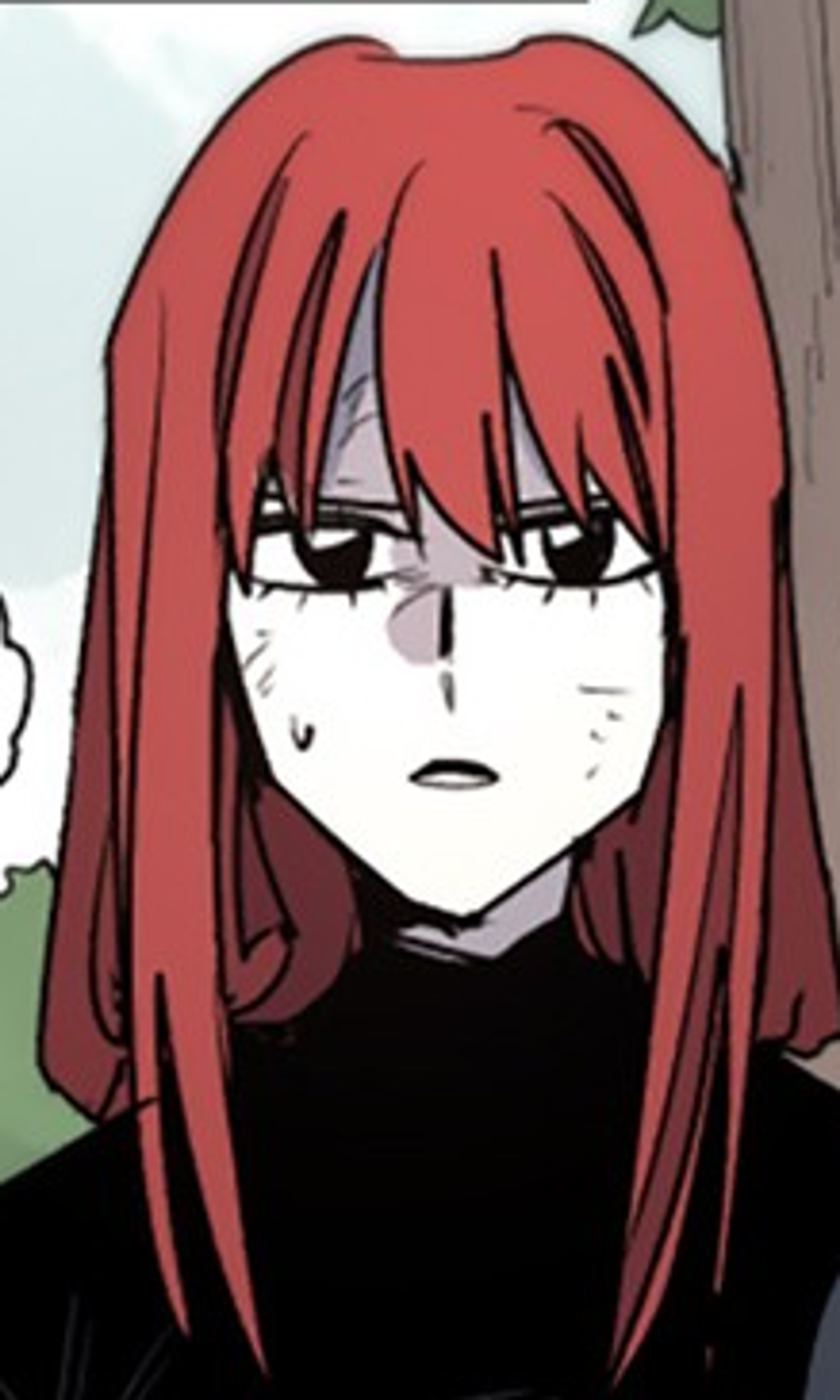 A young woman with red hair wearing a dark outfit, looking serious.