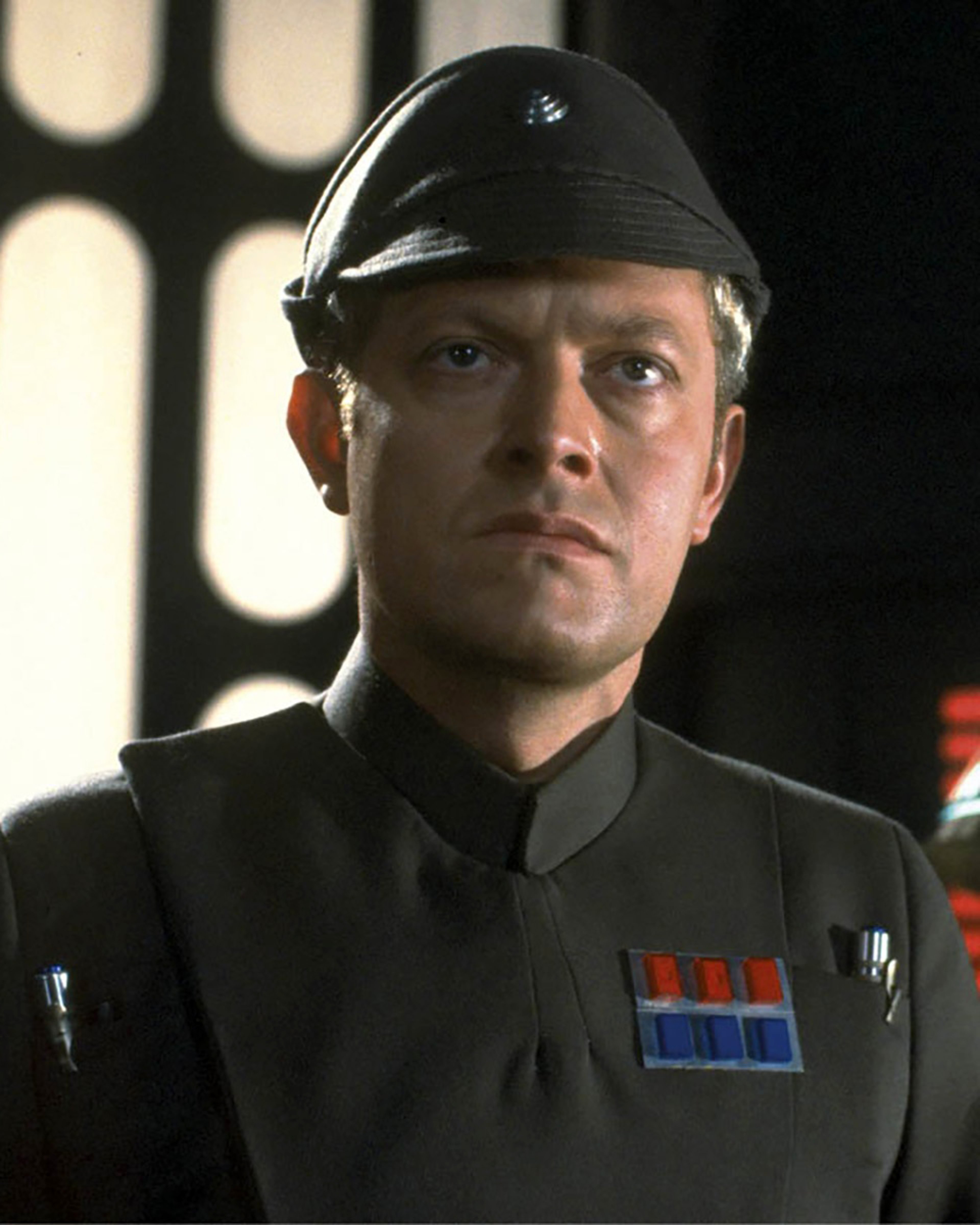 A serious-looking Imperial officer in a black uniform