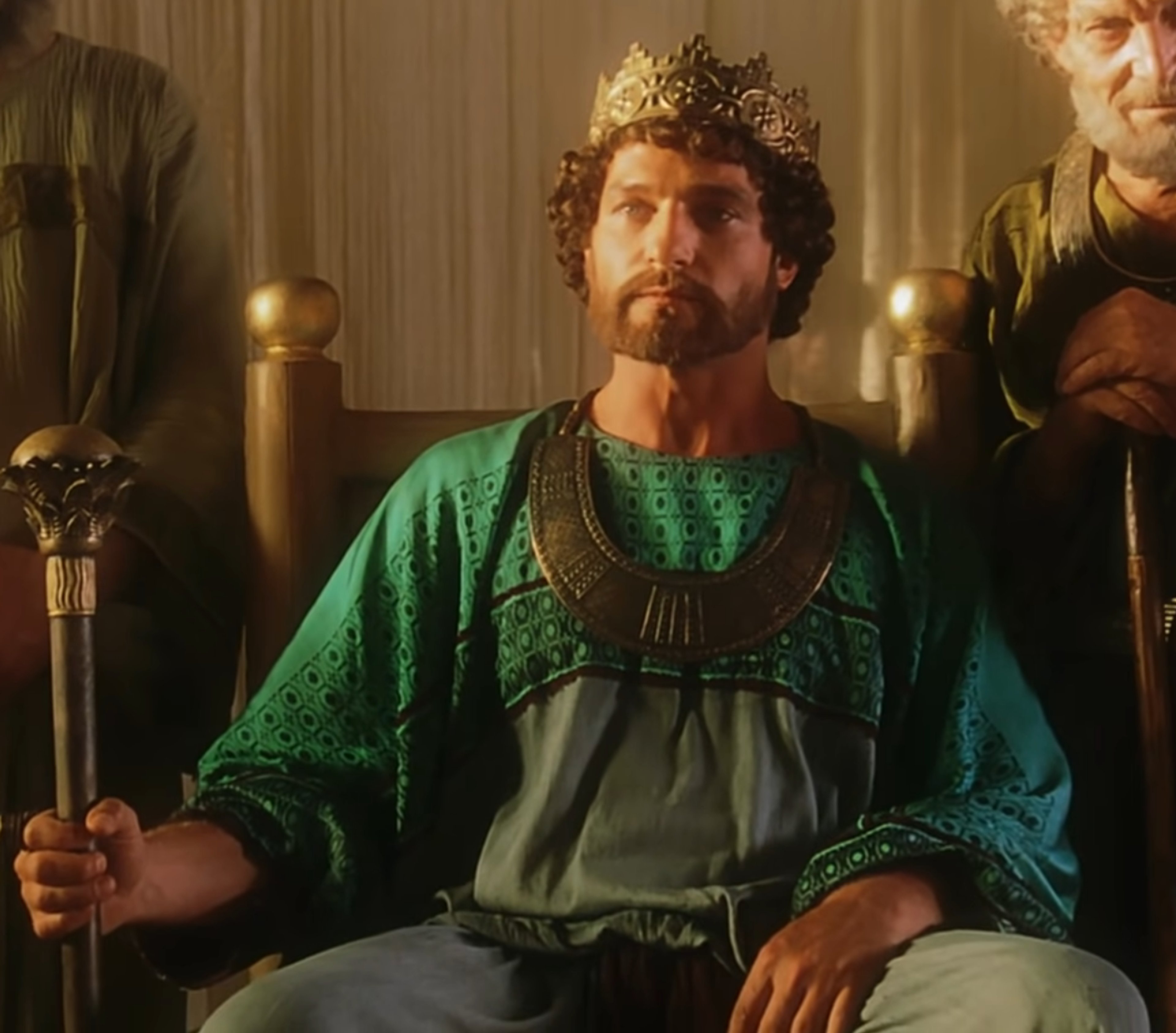 A powerful, imposing king or ruler seated on an ornate throne