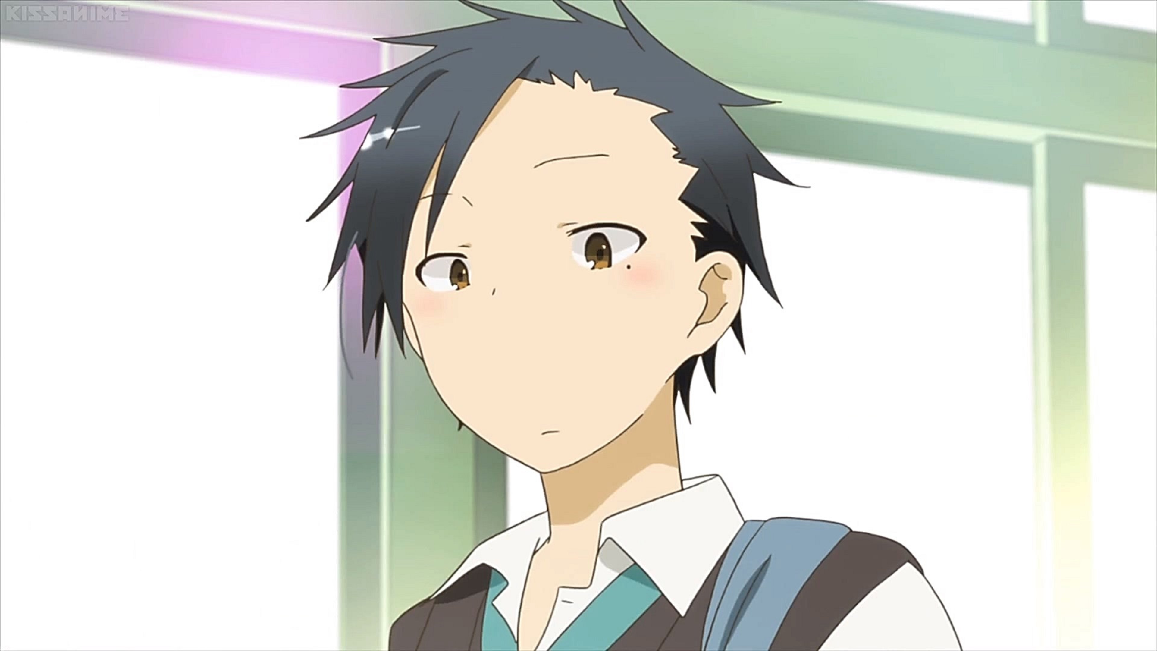 A young male high school student with a guarded expression