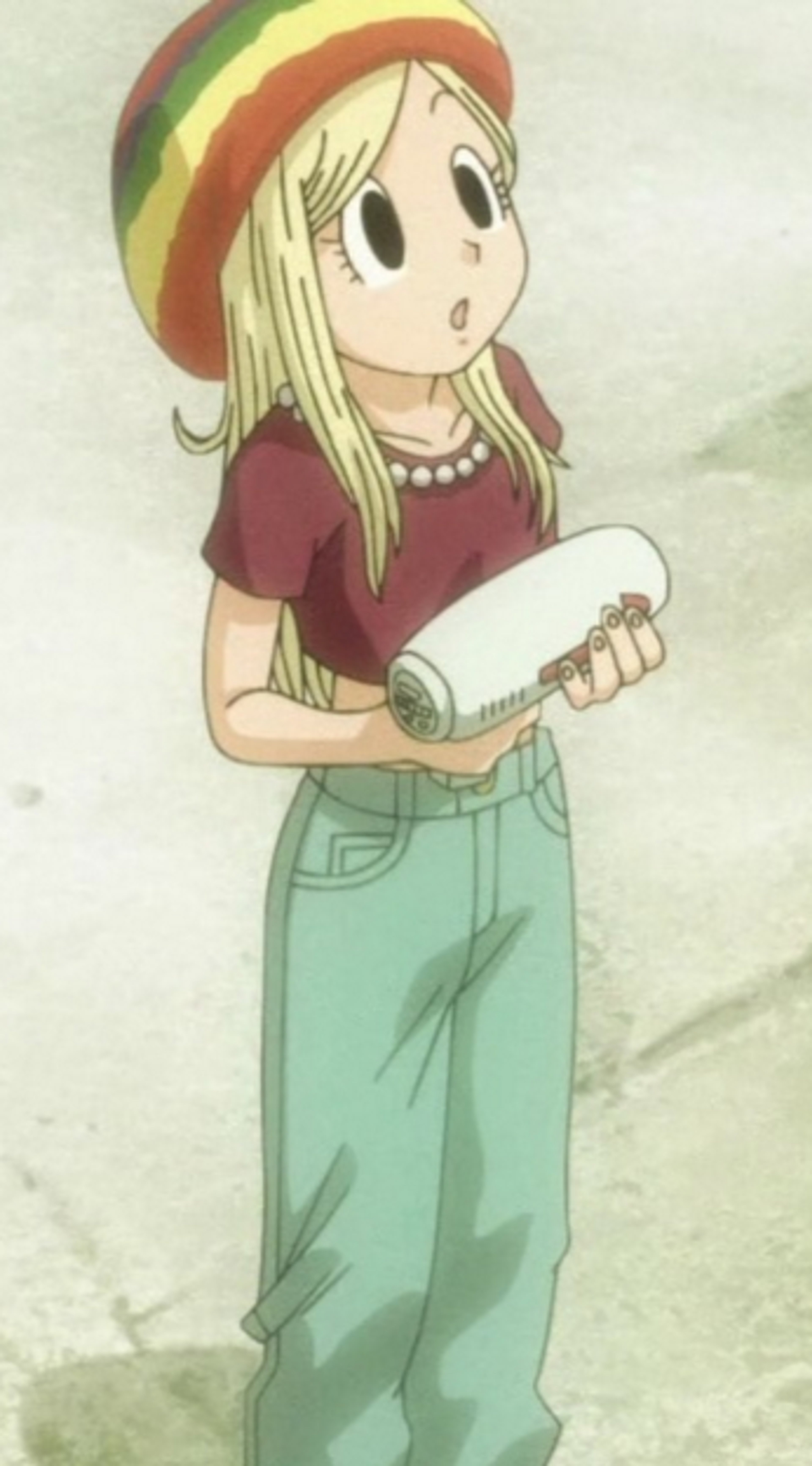 A young woman with blonde hair and a friendly expression, holding an object in her hands.