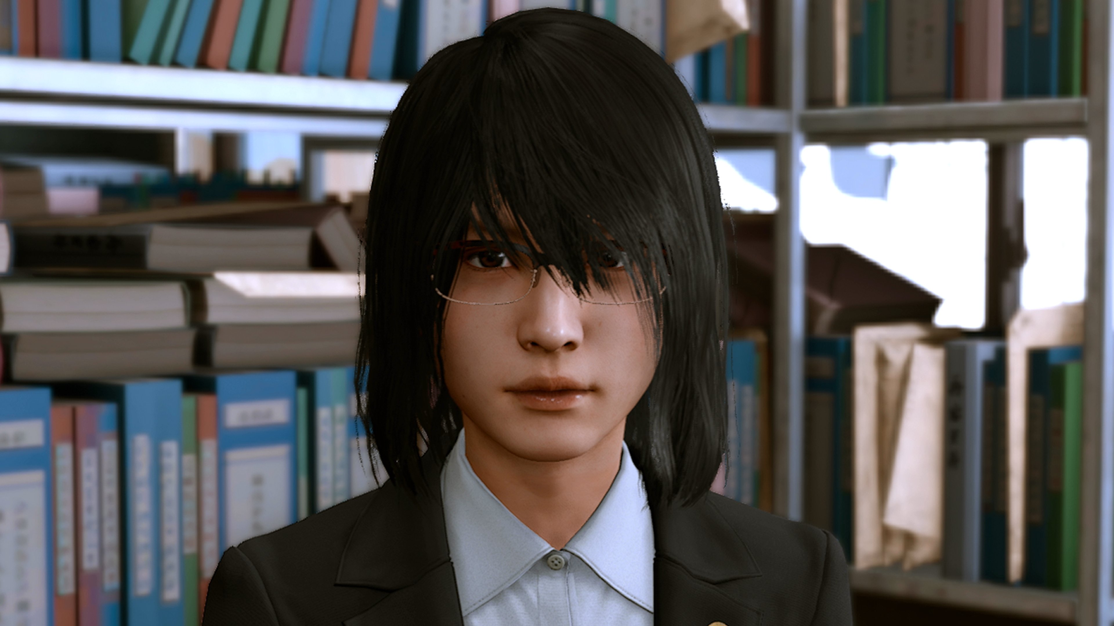 A young woman in a suit jacket standing in an office or library setting