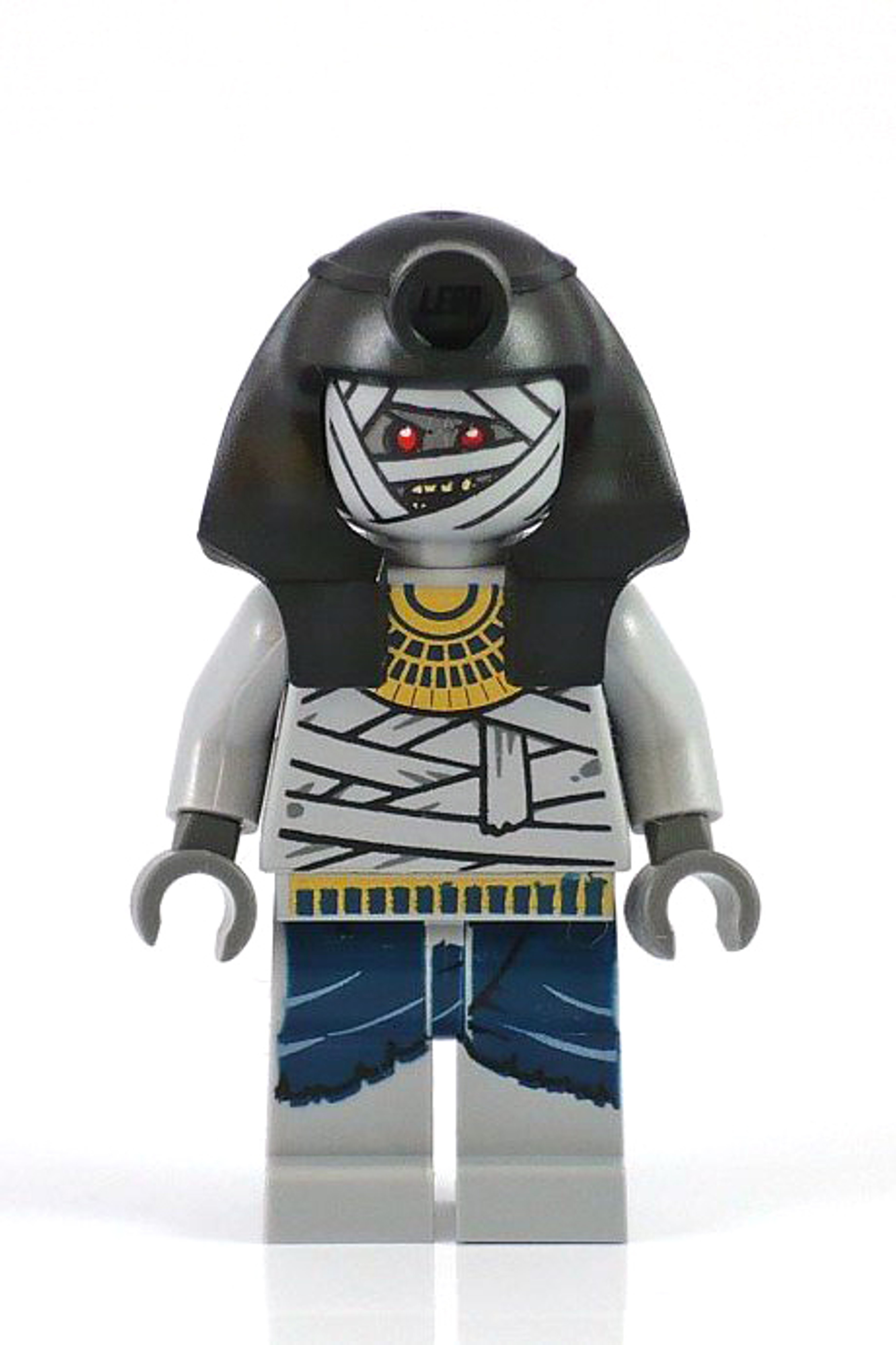 A Lego minifigure of a mummy warrior character with tattered grey wrappings, glowing red eyes, and a muscular build.