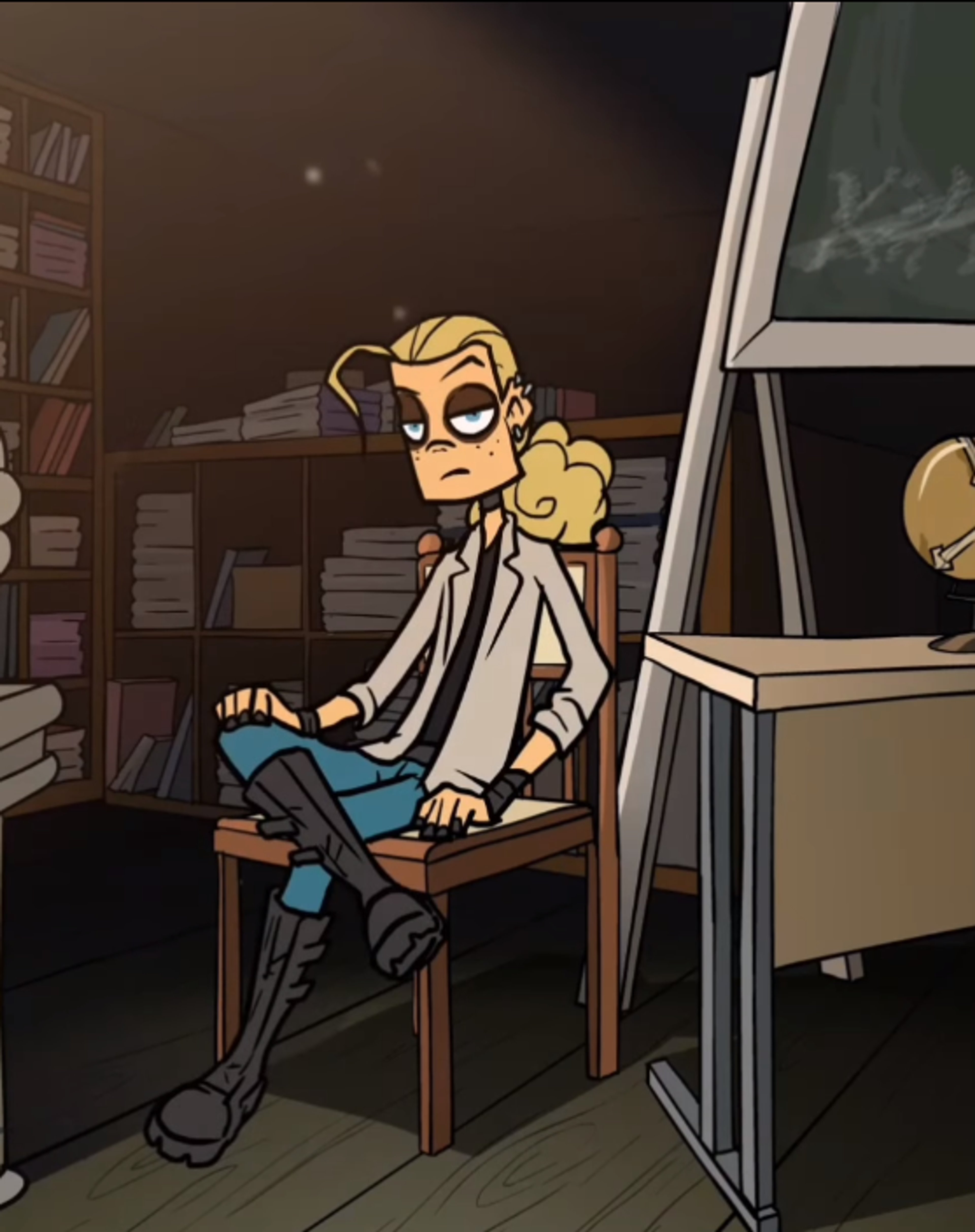 A young, gothic-looking male character sitting in a chair in a cluttered room