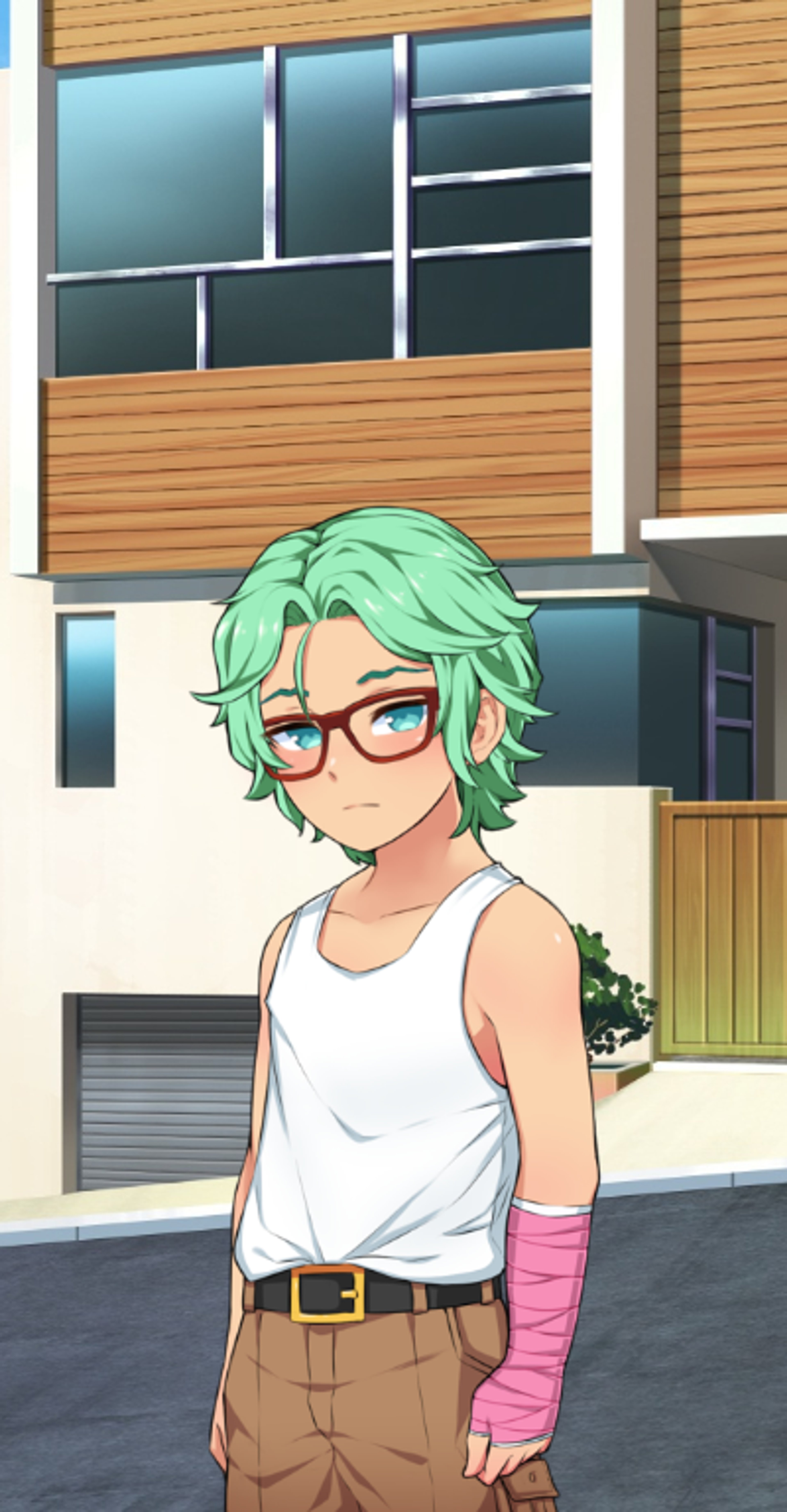 A young man with green hair and glasses standing in front of a building