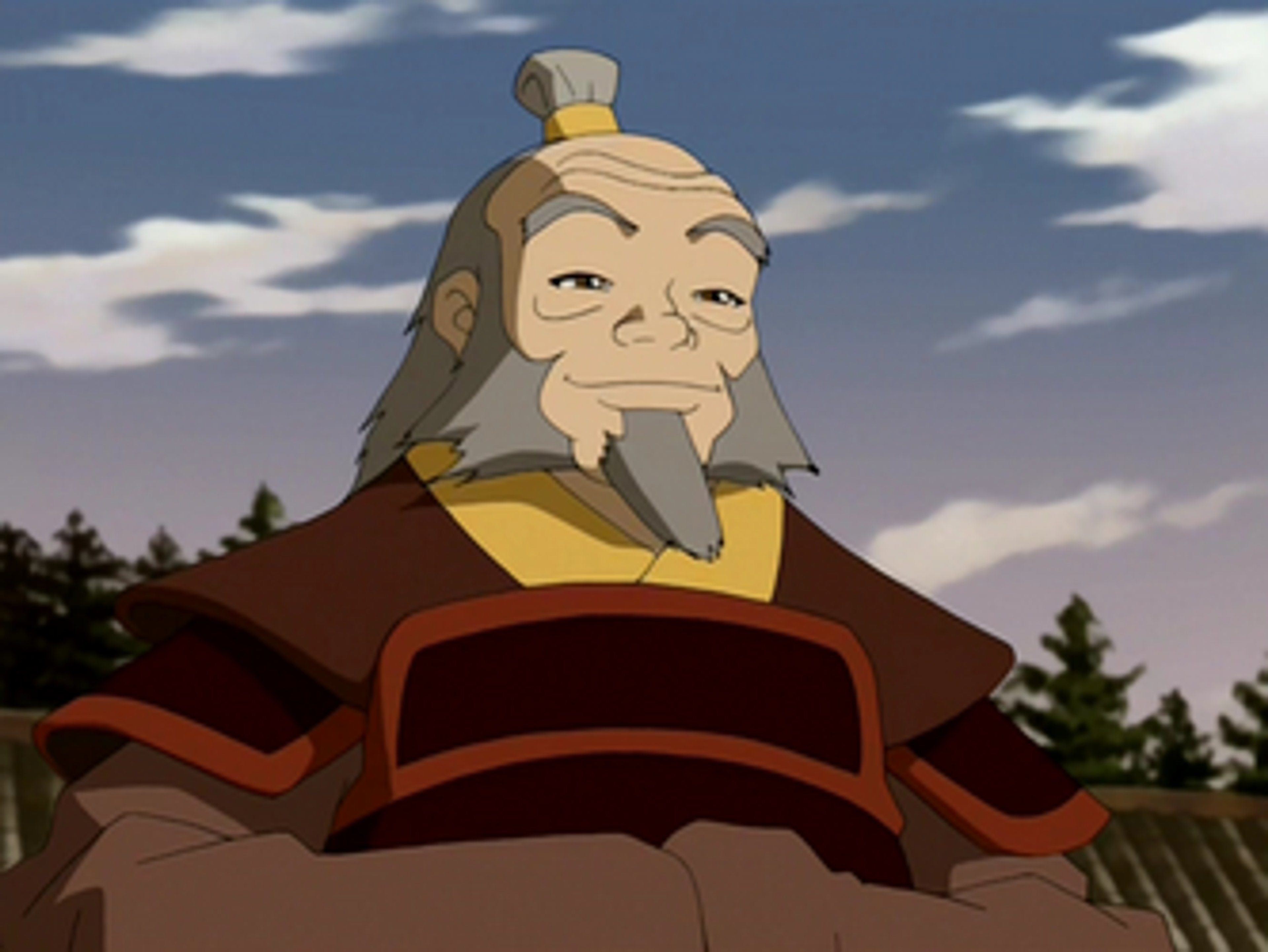 An elderly man with a long gray beard and mustache, wearing traditional Fire Nation robes, seated on a throne-like chair against a backdrop of clouds and mountains.