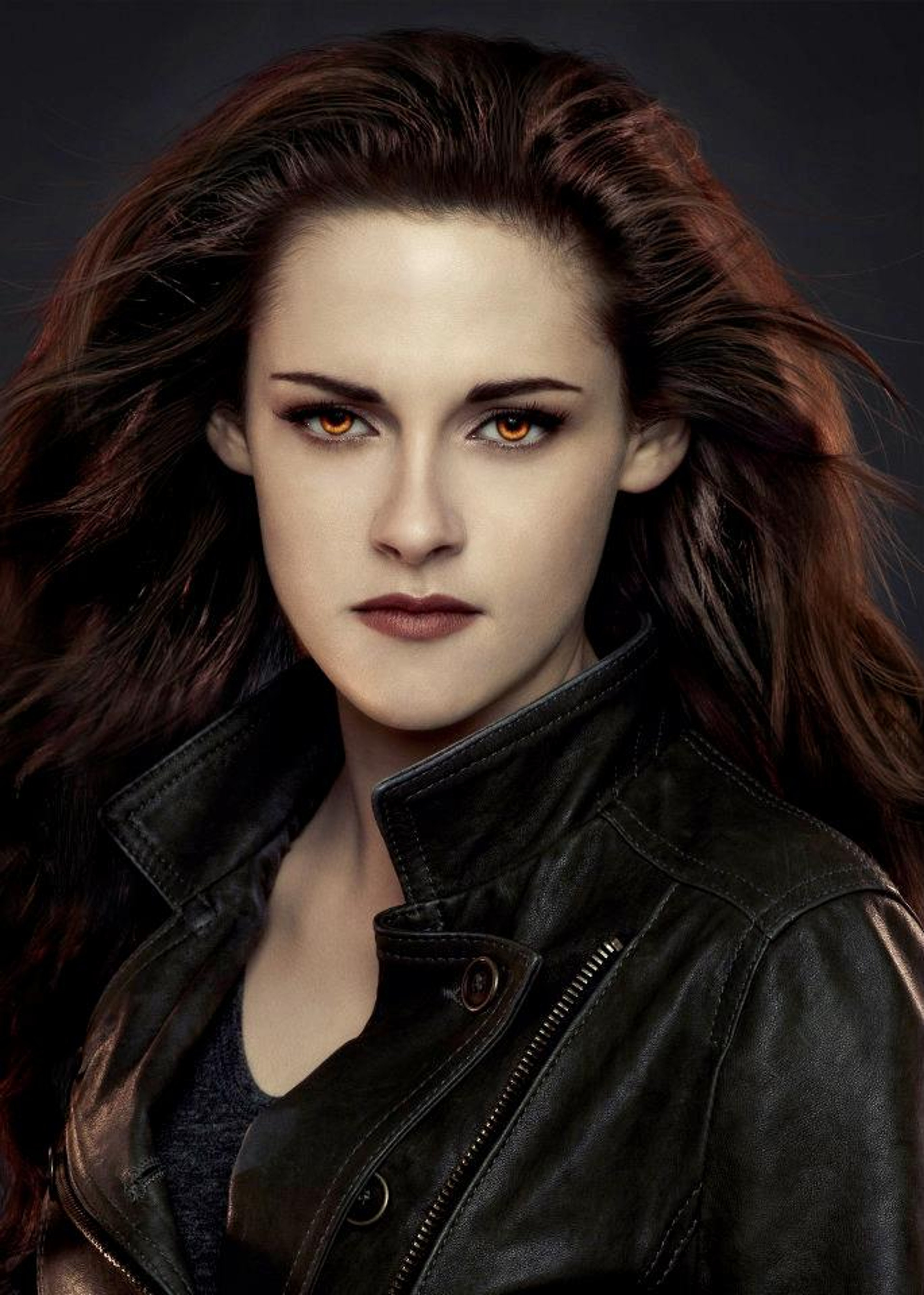 A young woman with dark hair and intense eyes wearing a black leather jacket