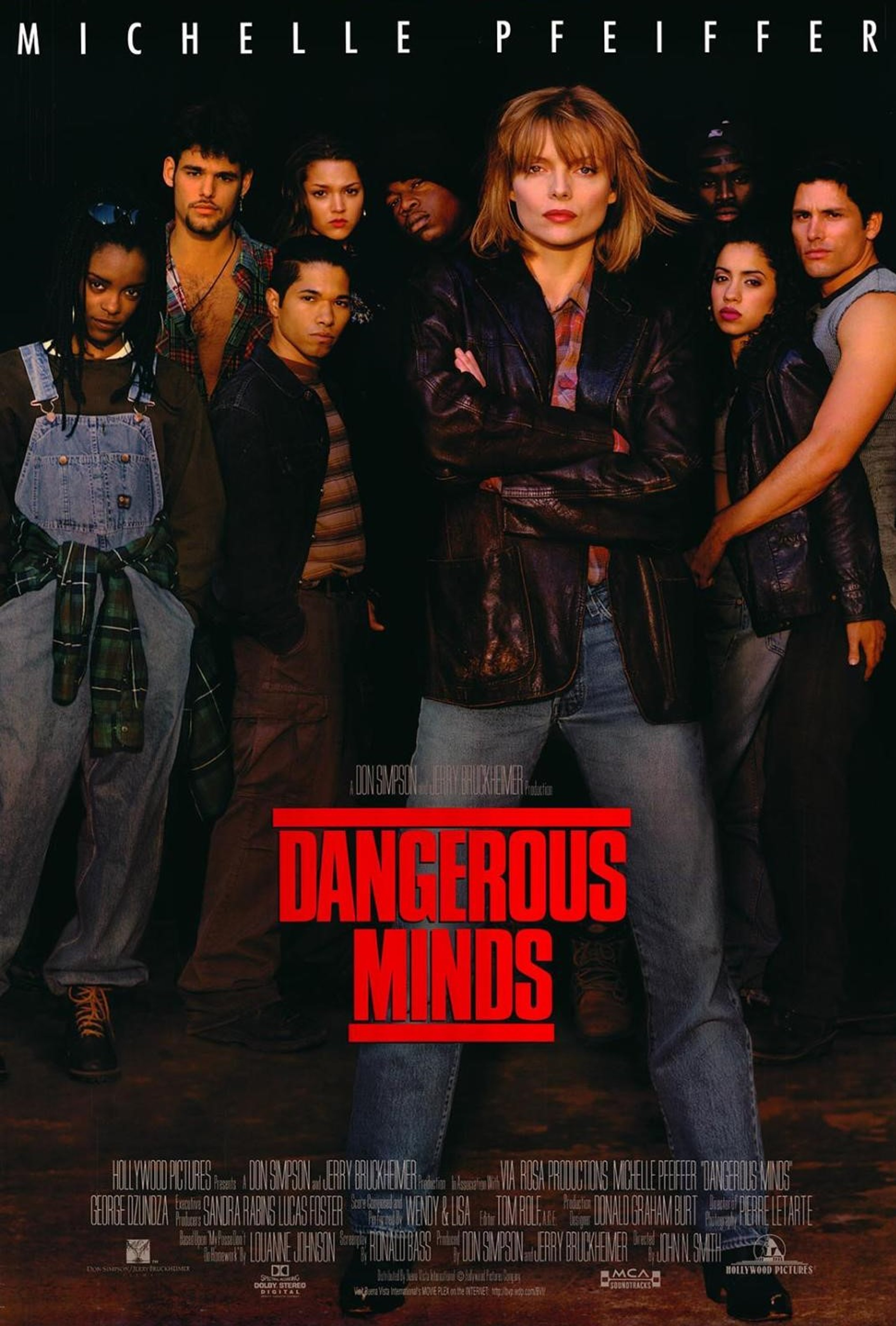 A group of people, including a woman with red hair who appears to be the main character, in an urban, gritty setting.