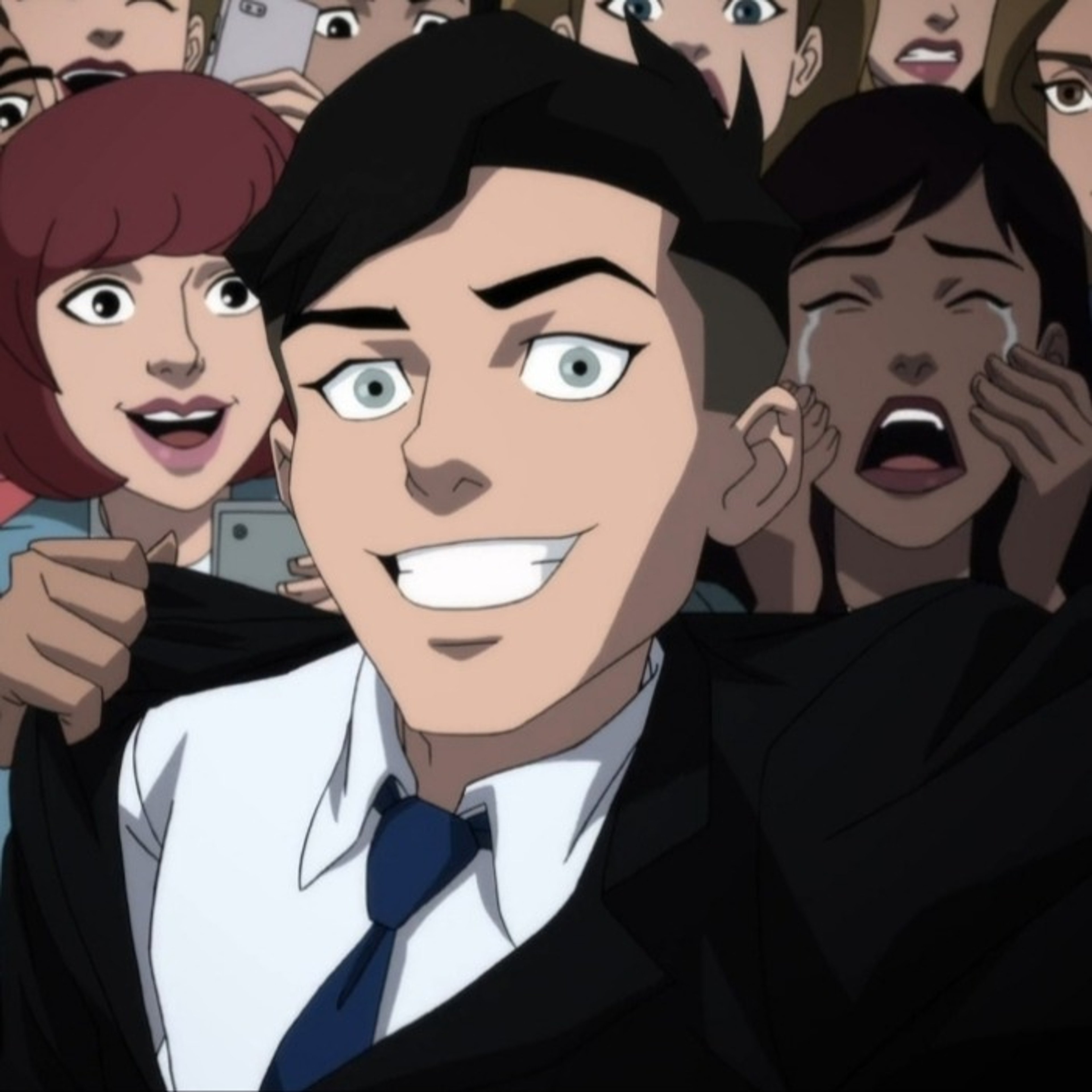 A young man in a suit and tie, likely the fictional superhero character Superboy.