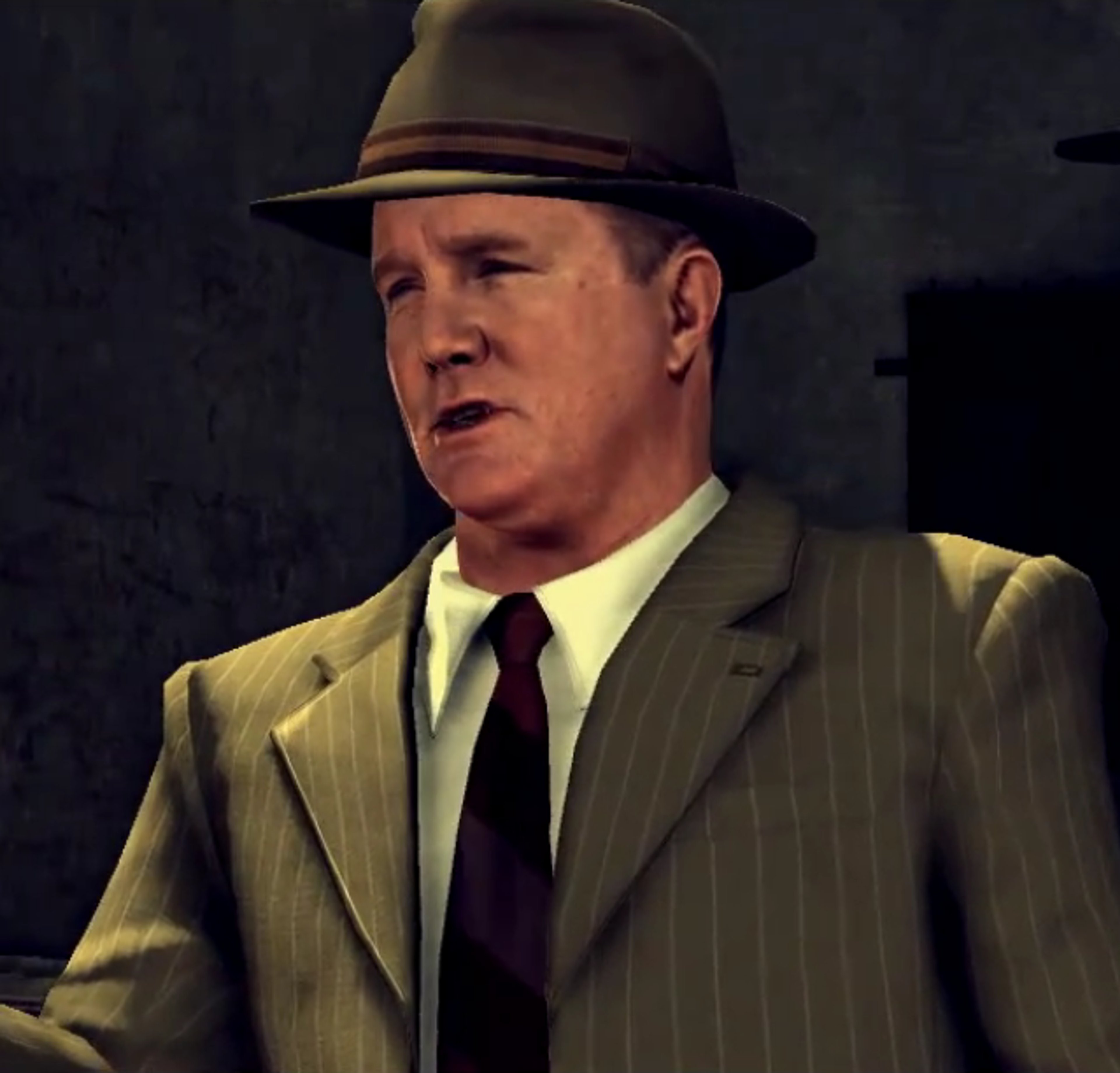 A middle-aged man in a tan suit and hat with a serious expression, appearing to be a police detective.