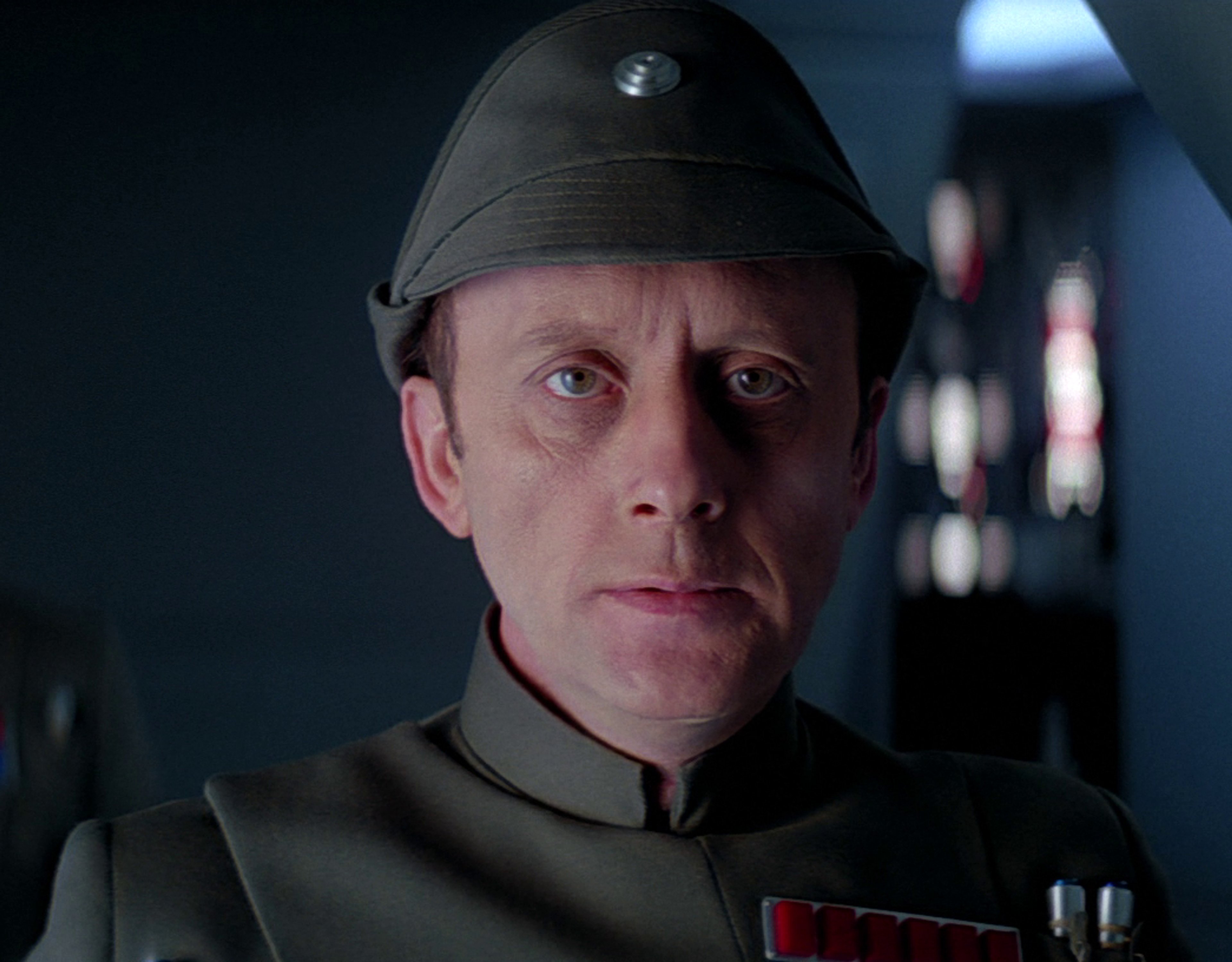 A middle-aged man in an Imperial military uniform, with a serious expression on his face.