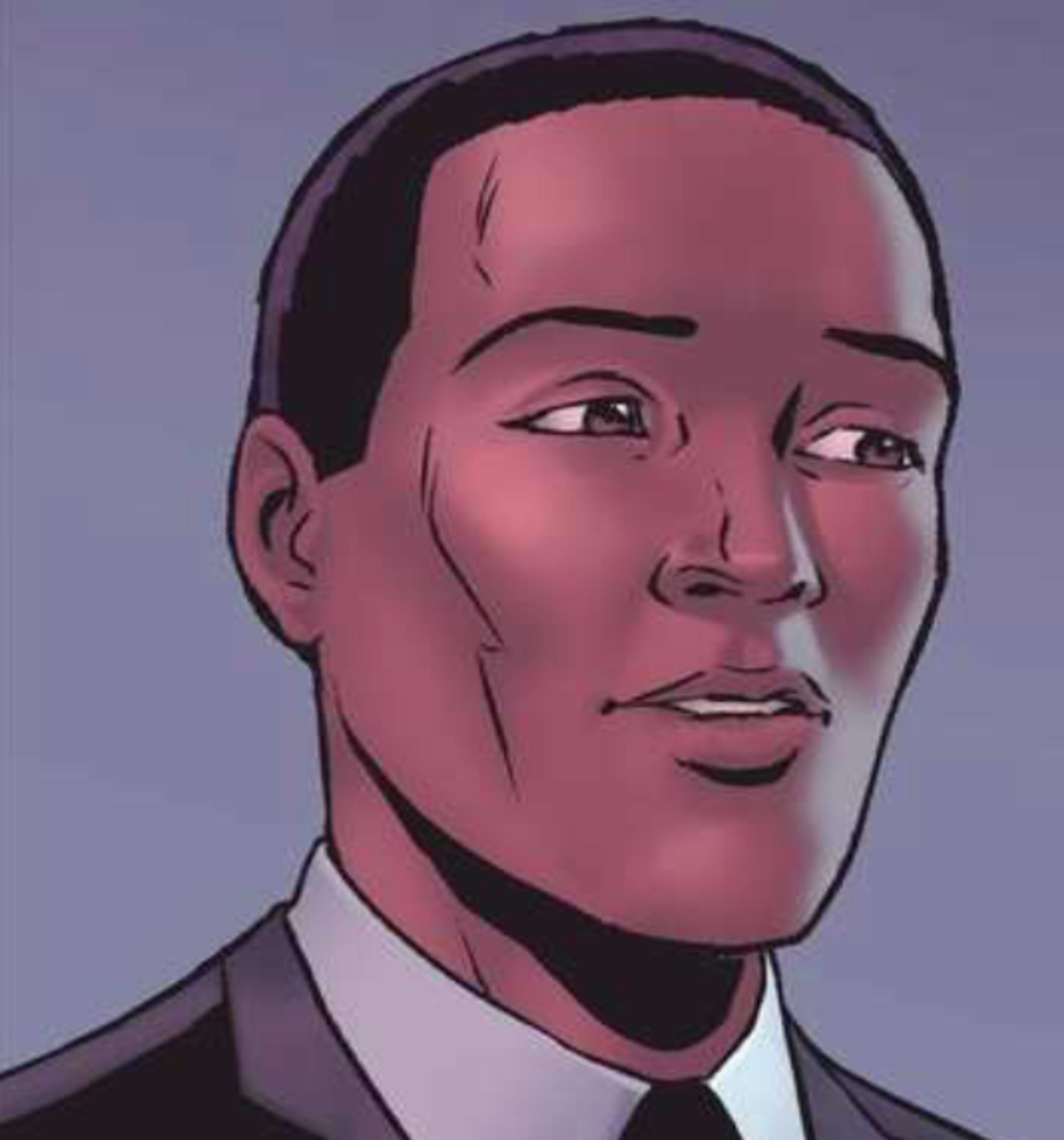 A man with dark skin and a serious expression, wearing a dark suit and tie.