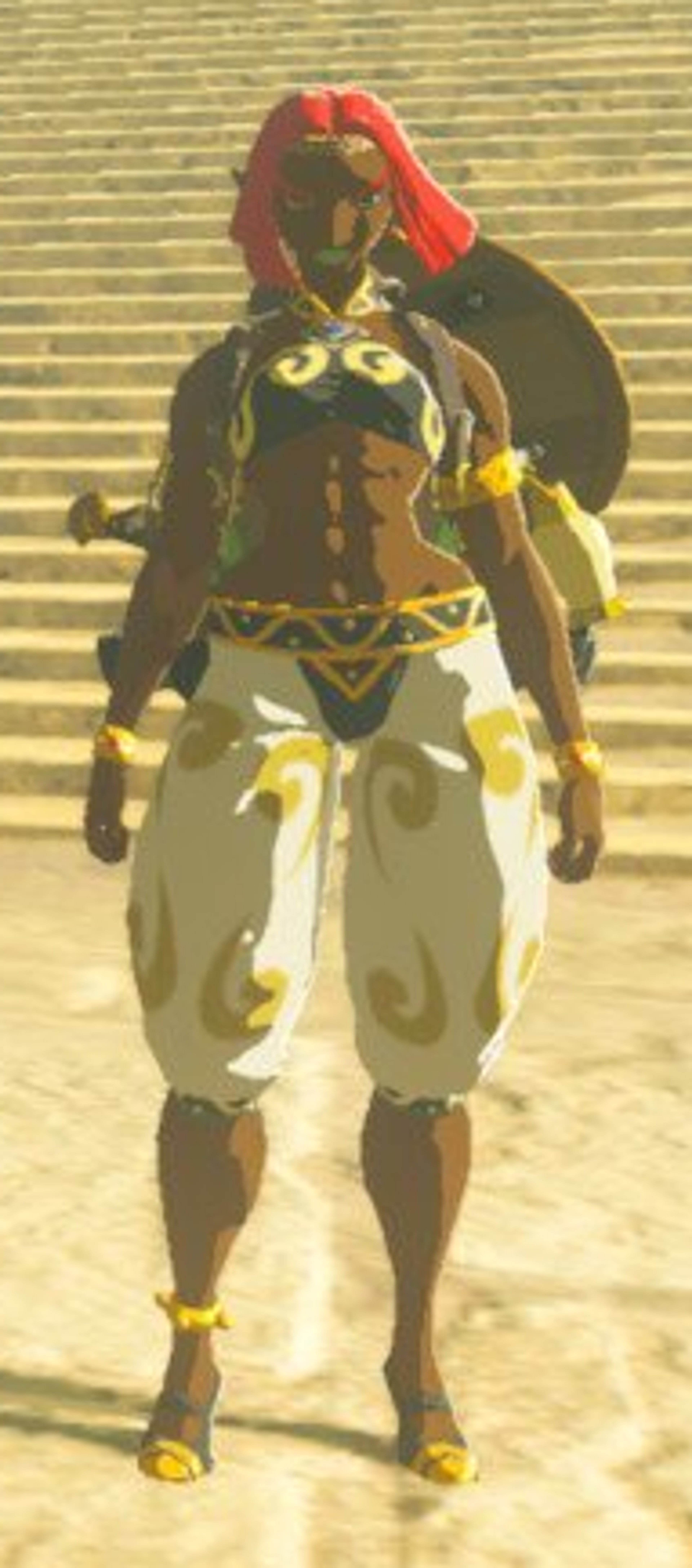 A Gerudo woman in a combat-ready stance, wearing a red headpiece and ornate yellow and white outfit.