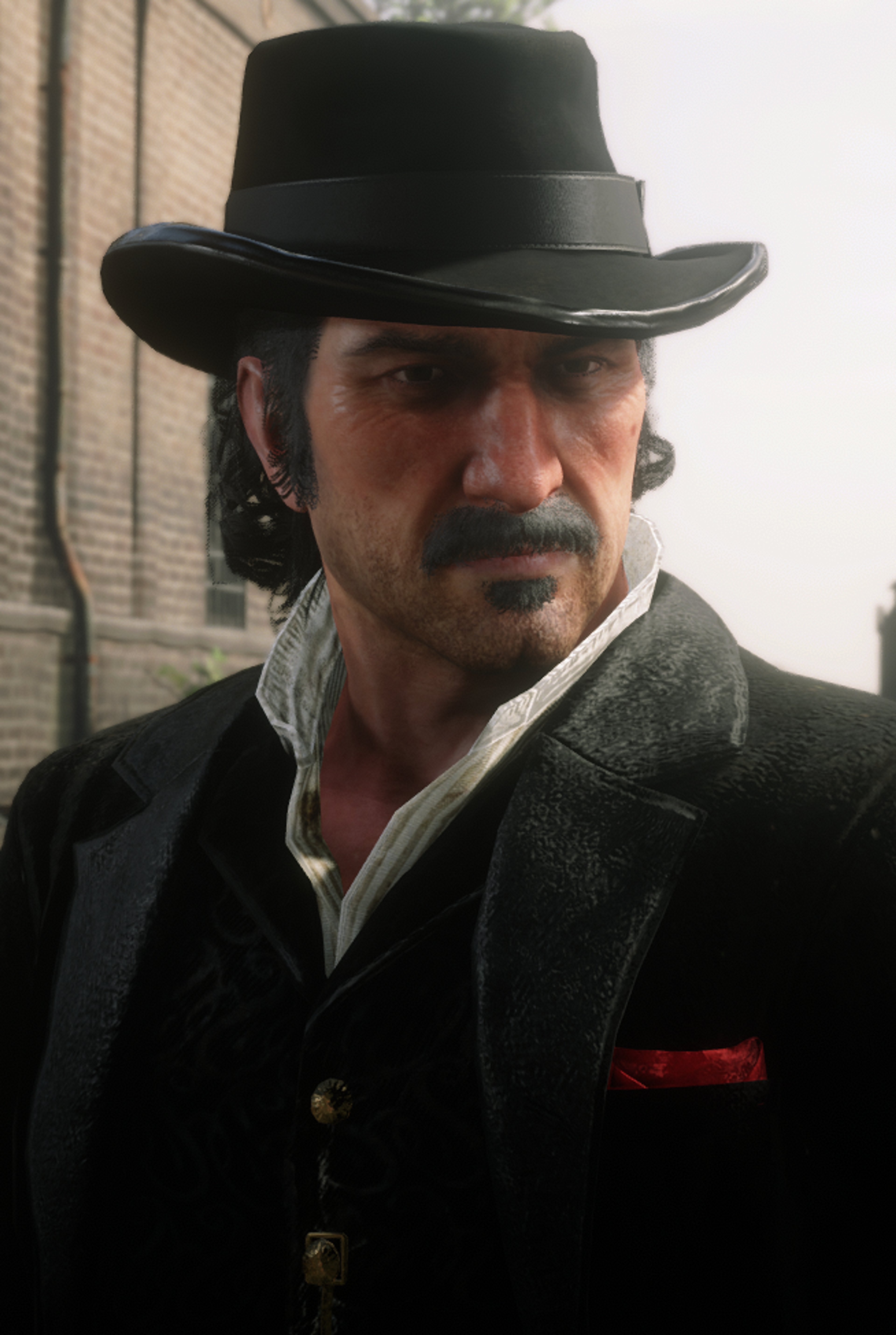 A man with a mustache and beard wearing a black hat and dark coat, with a serious expression