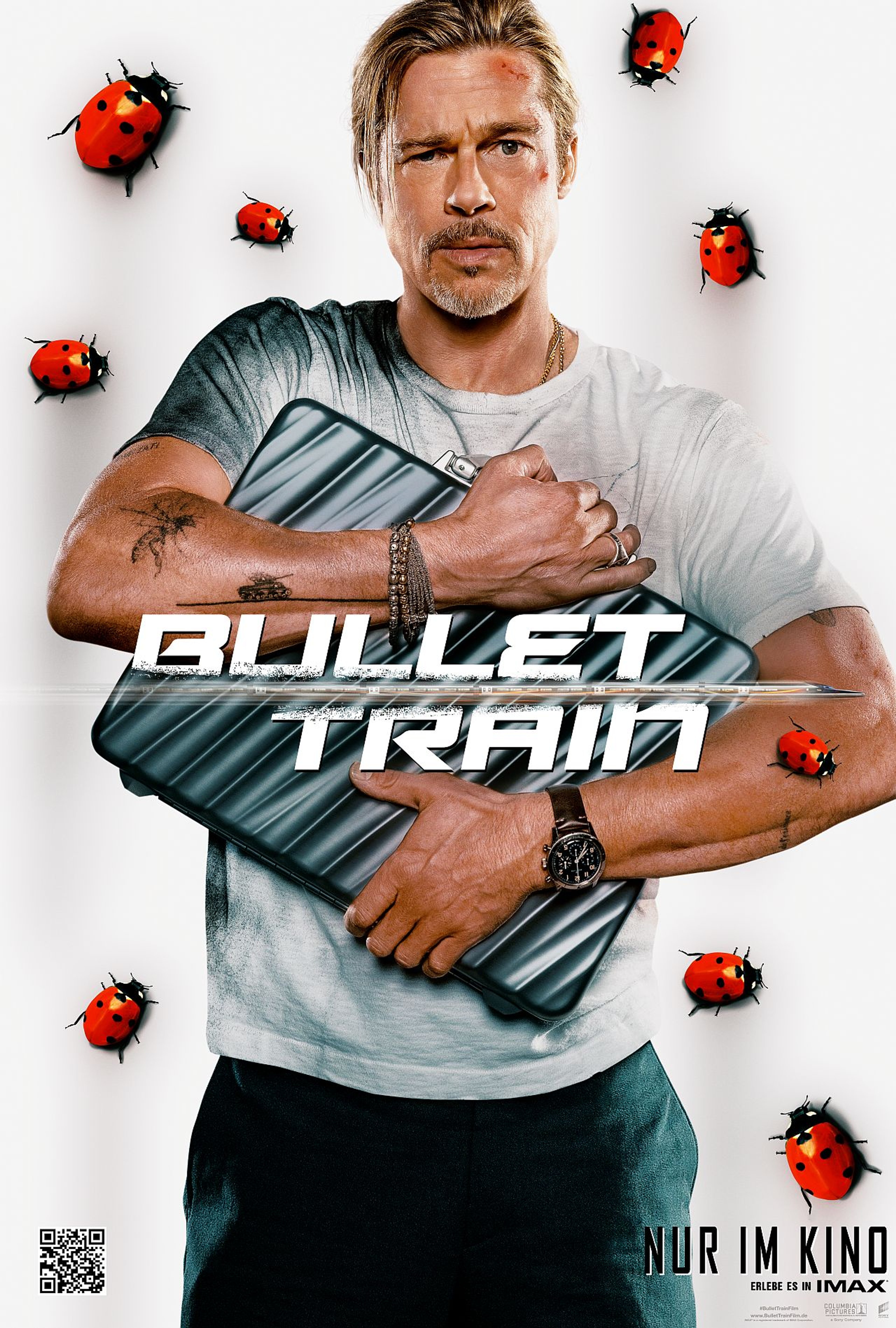 A man with blonde hair and a beard holding an object in front of a white background with red insects around him.