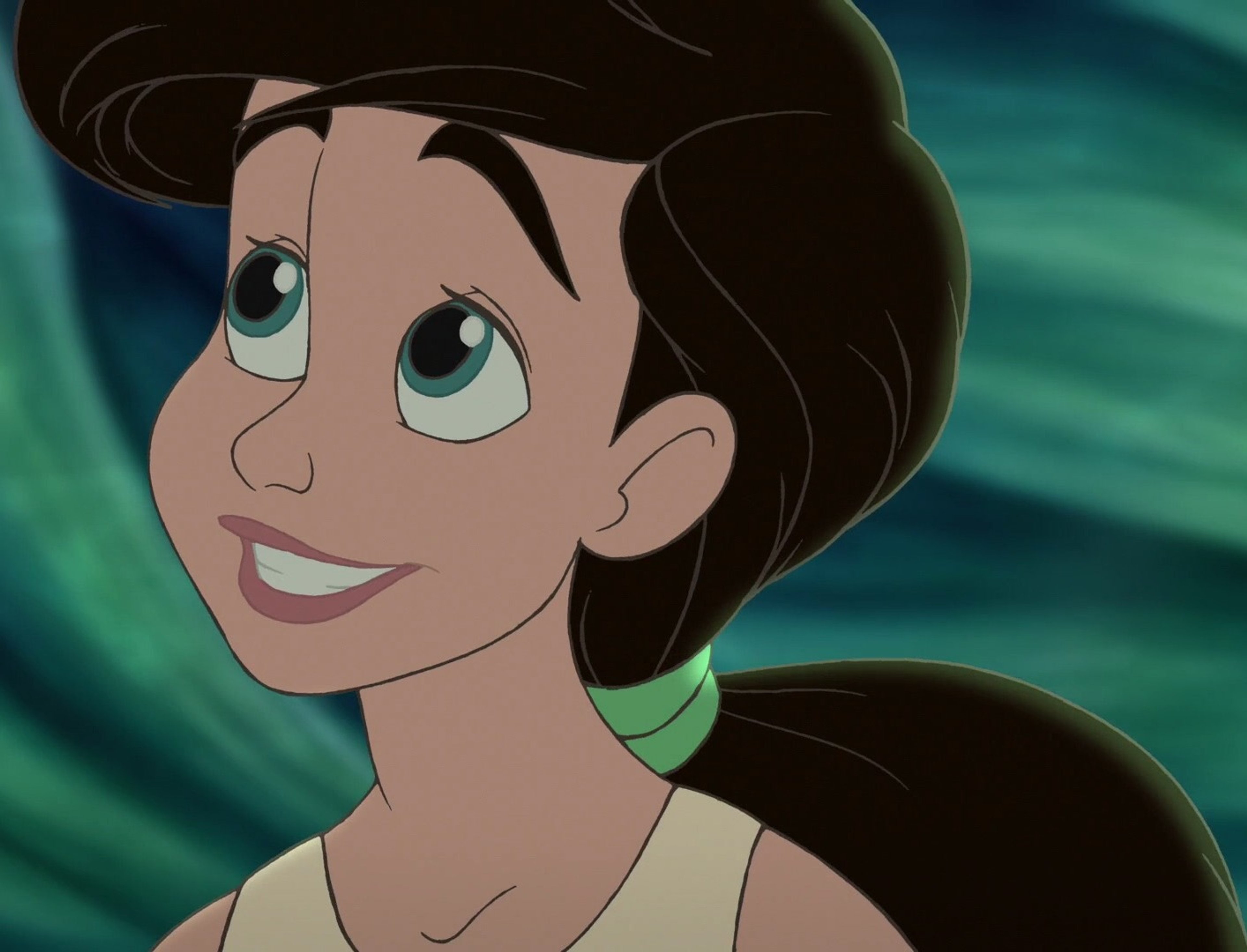 An animated female character with large eyes, dark hair, and a green top