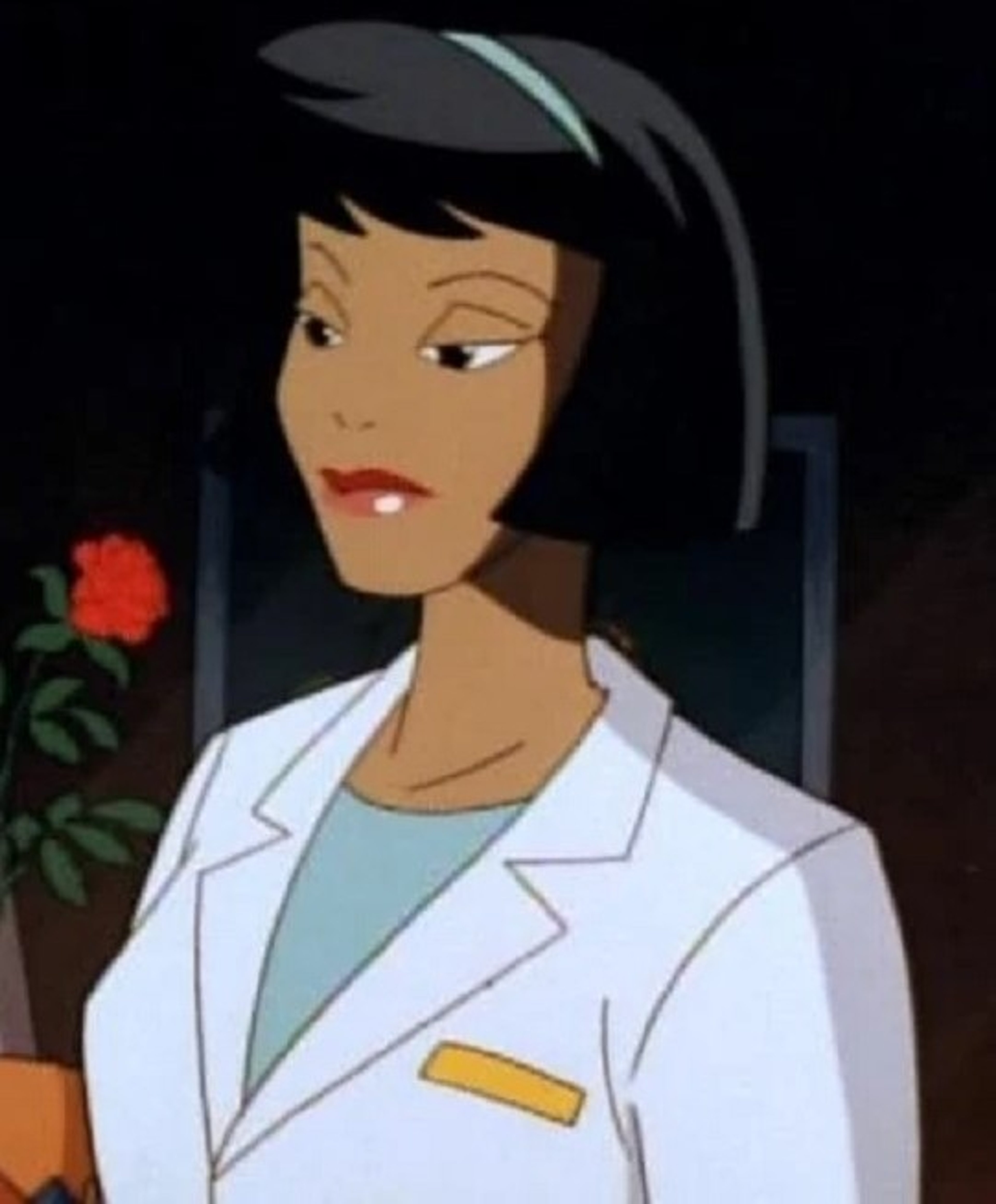 An African American woman in a white lab coat with a serious expression