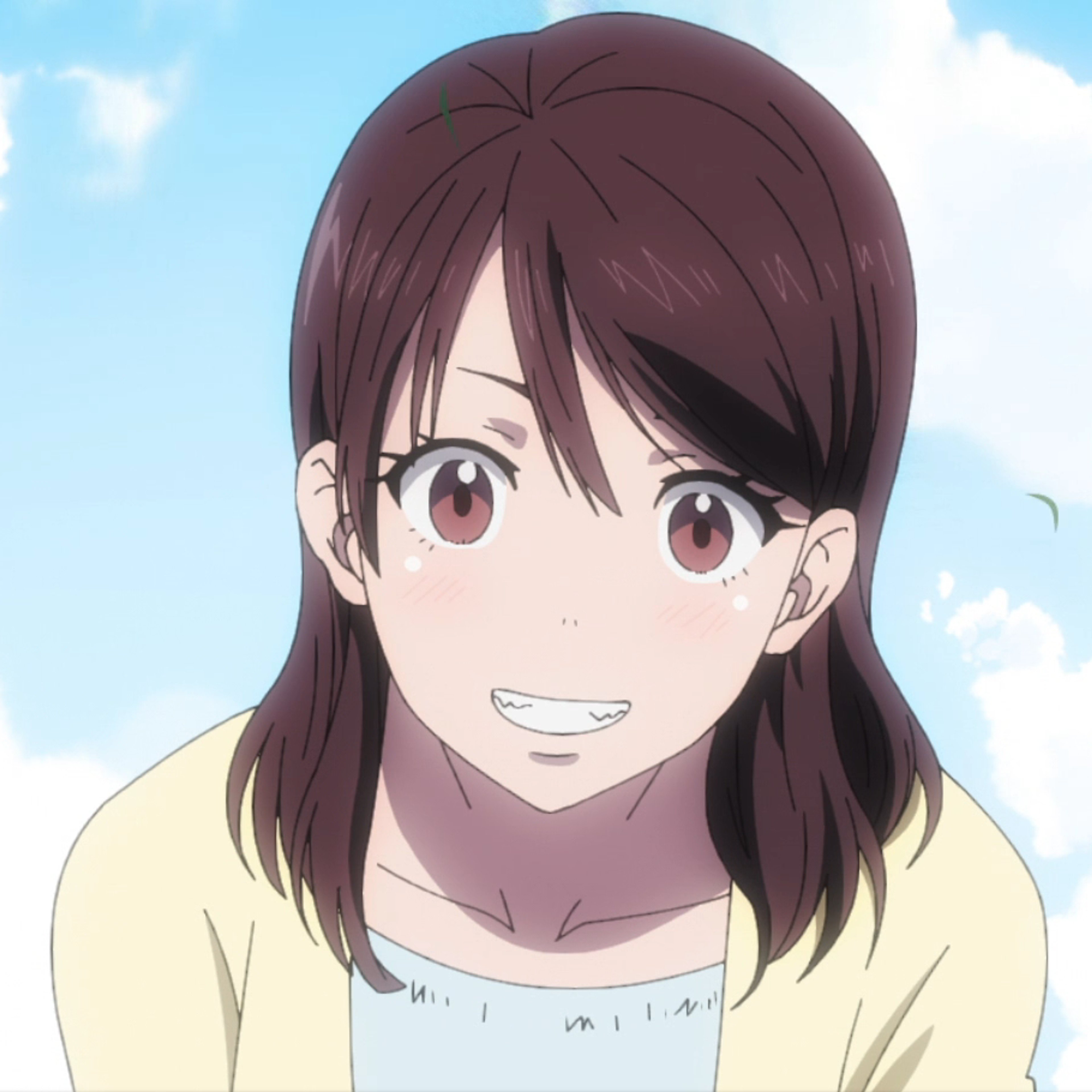 A young woman with black hair and a warm, caring expression