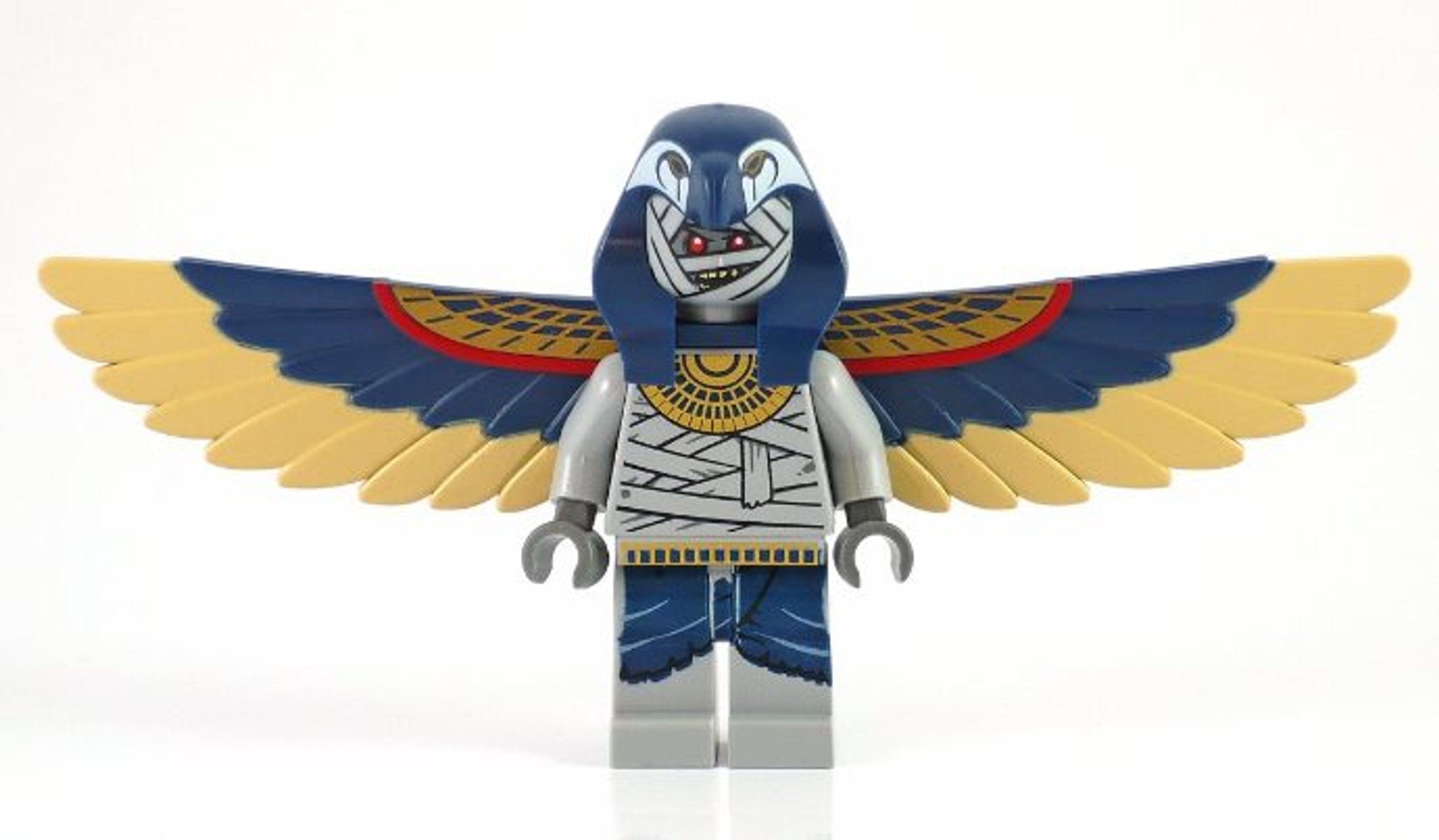 A Lego minifigure of a winged mummy warrior with a falcon-shaped headdress and hieroglyphic markings