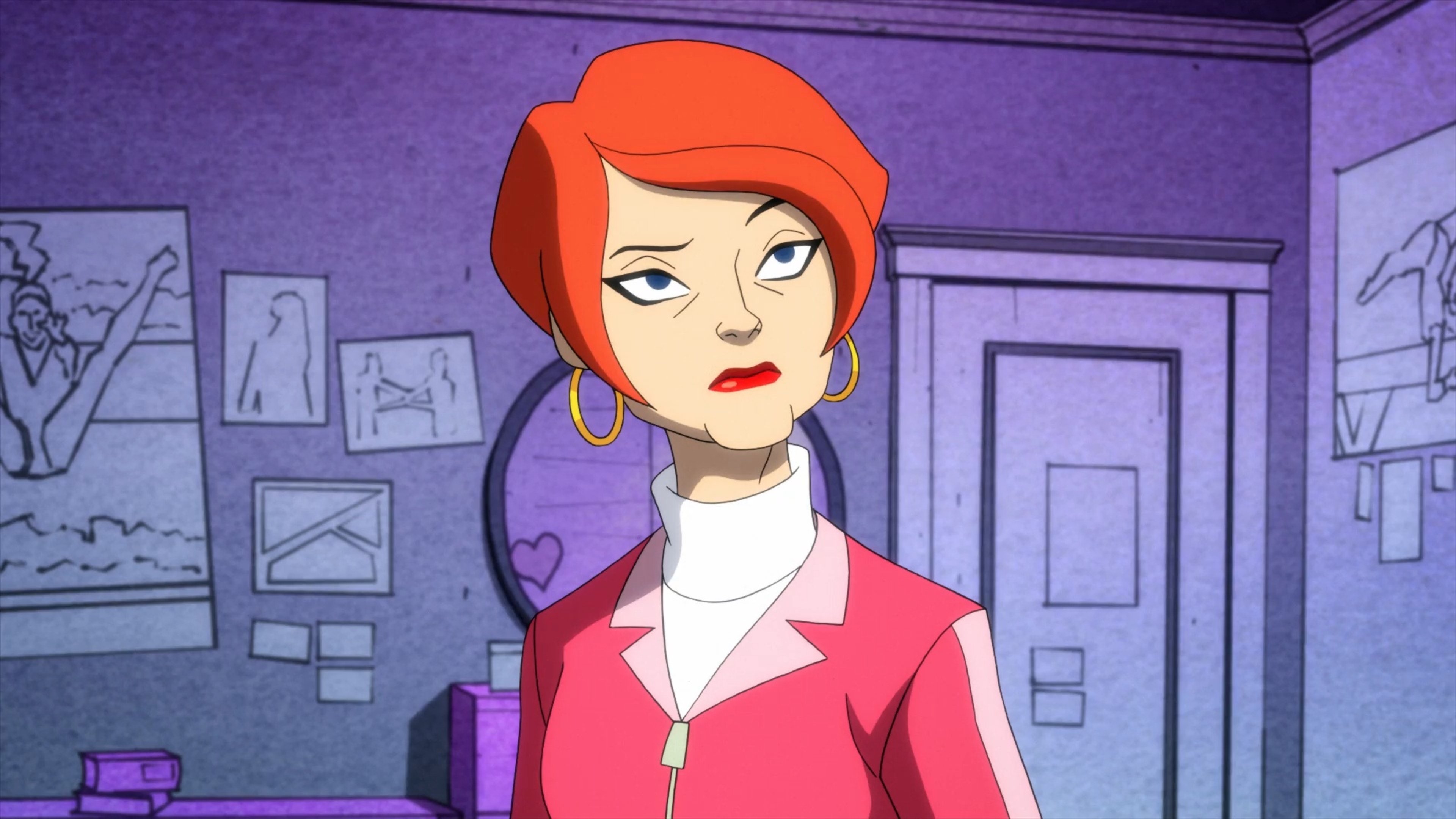 A middle-aged woman with red hair in a red jacket in an indoor setting