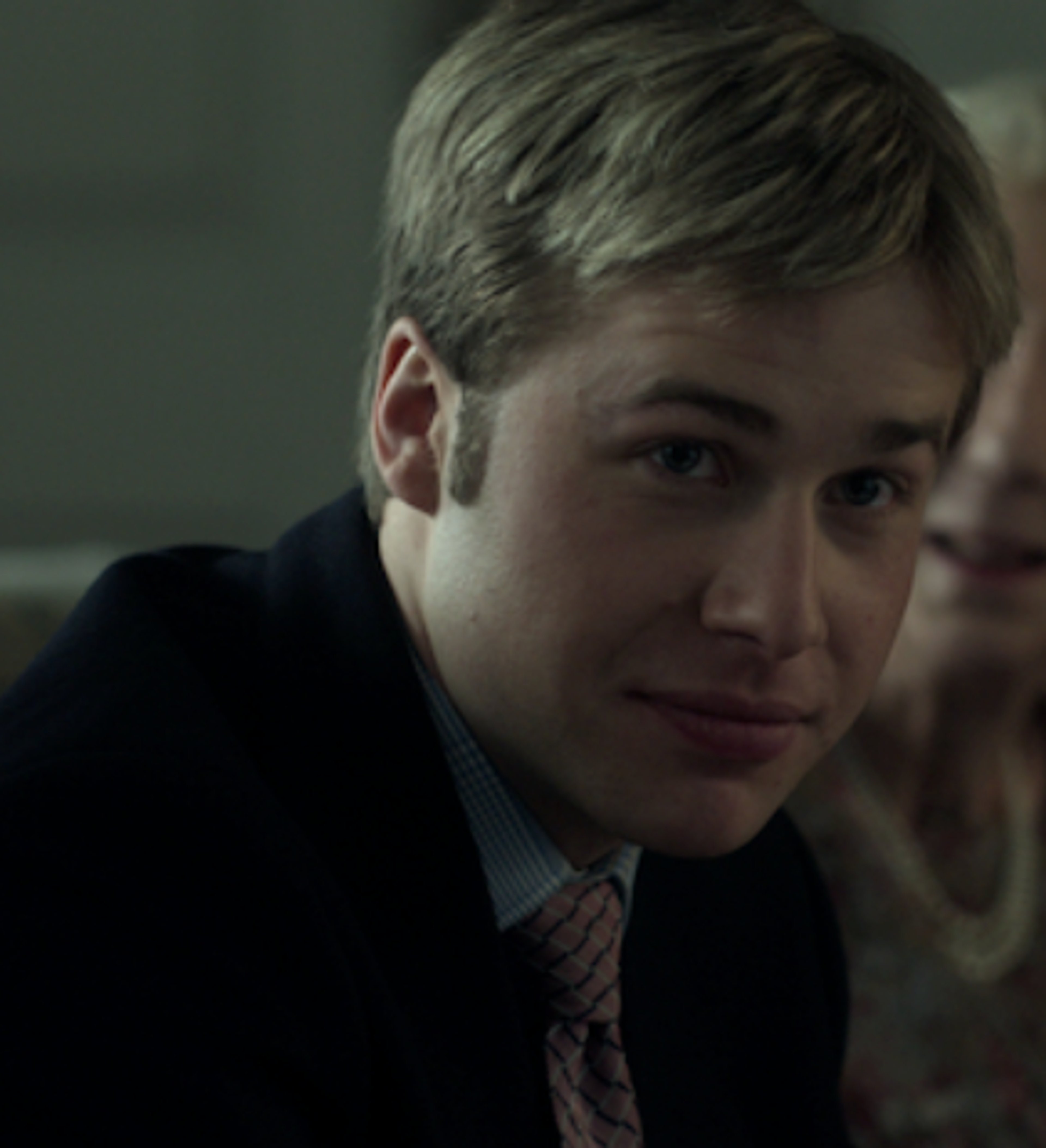 A young man in a suit and tie, likely Prince William of the British royal family.