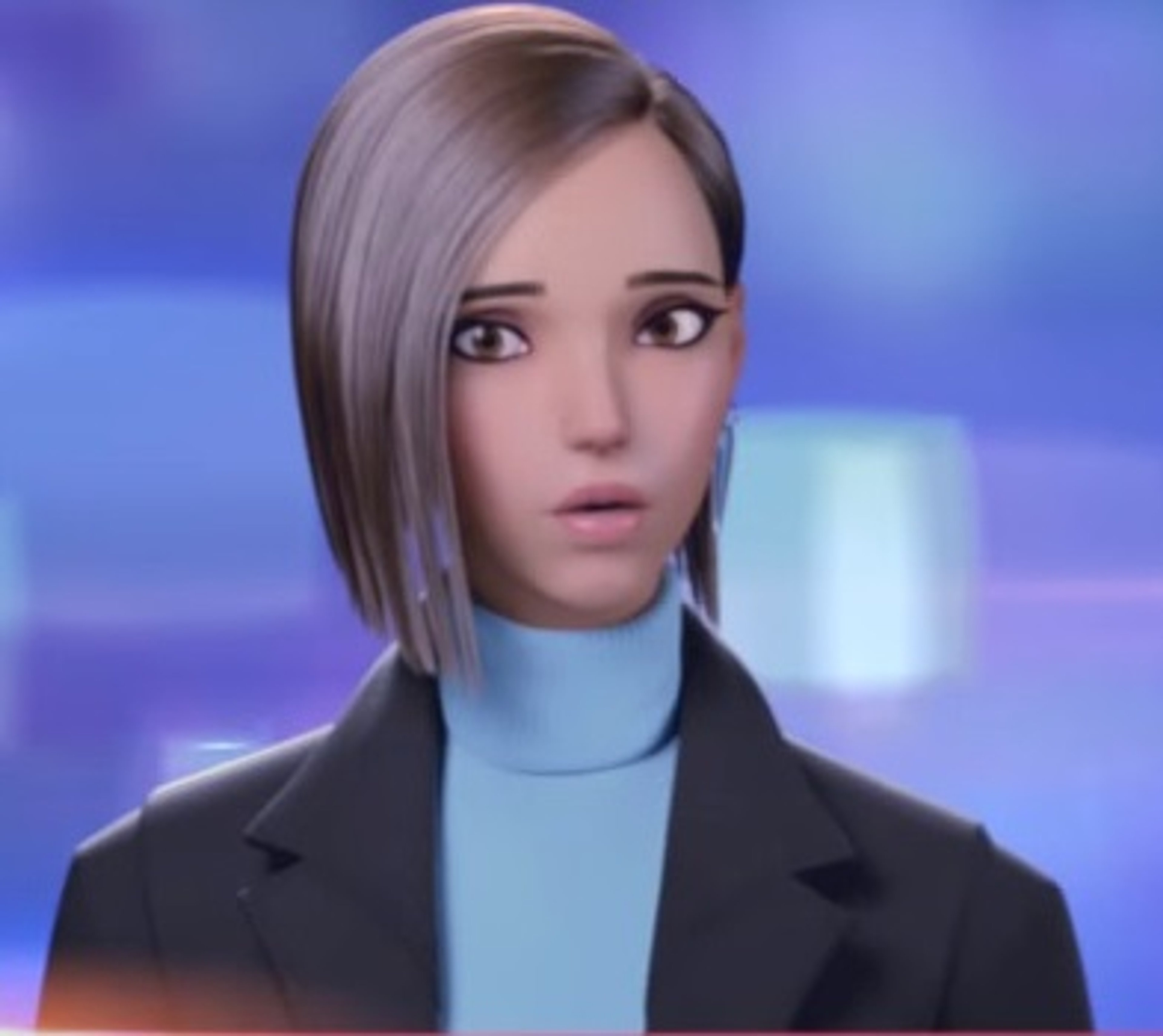 A woman with dark hair and glasses wearing professional attire, looking serious and focused.