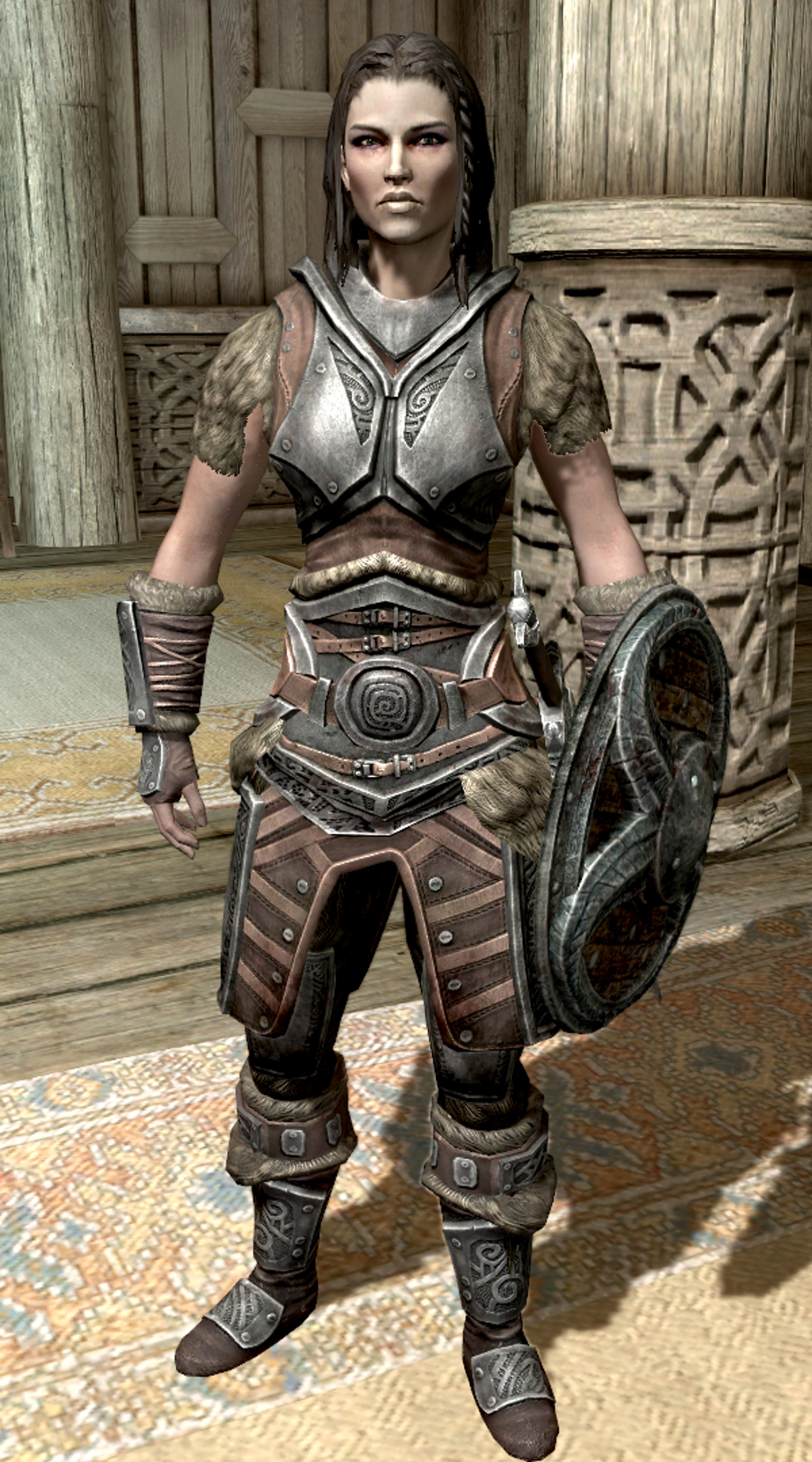 A female Nord warrior character in heavy armor, holding a shield and ready for battle.