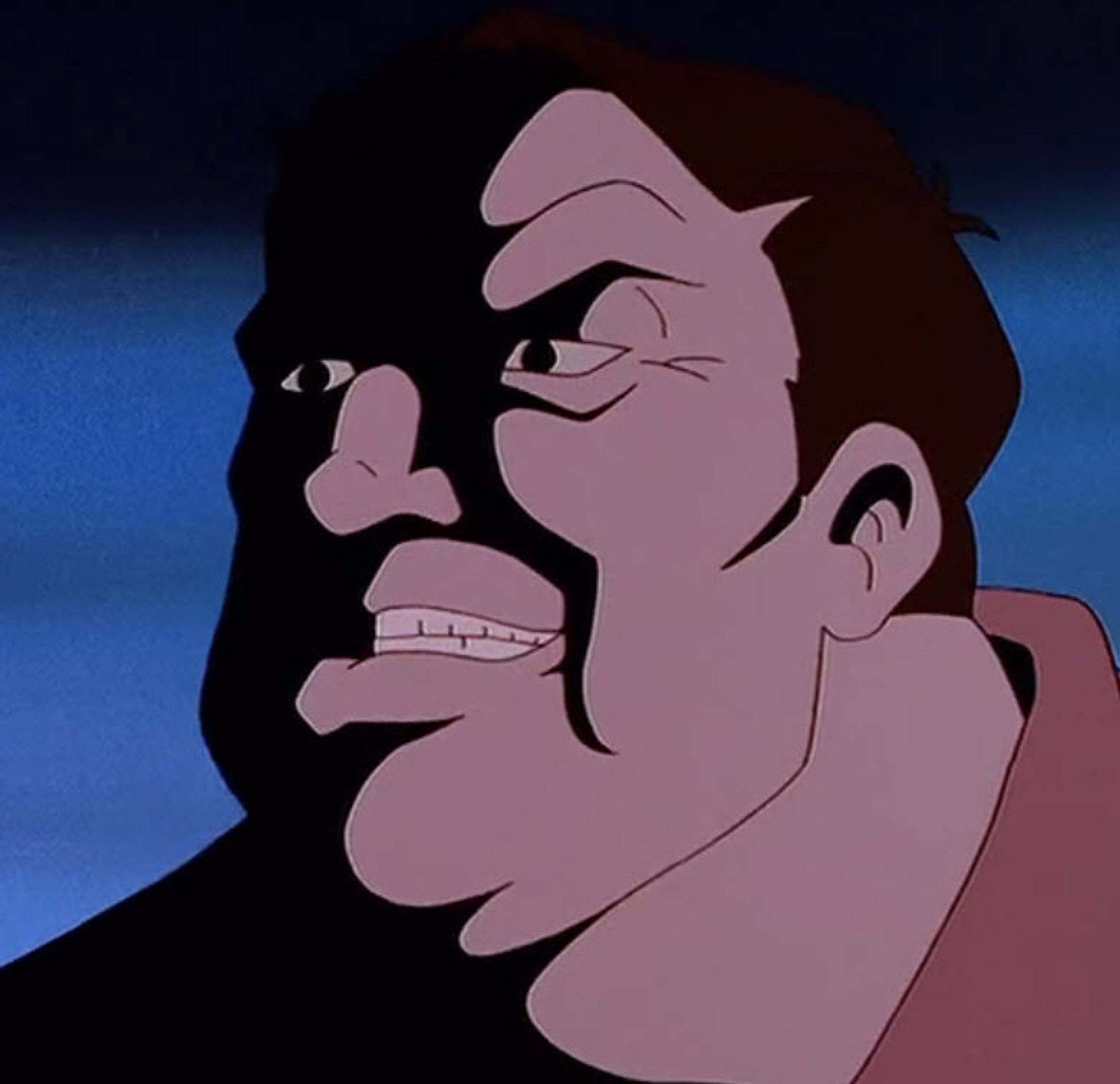 A middle-aged man with a stern, angry expression on his face