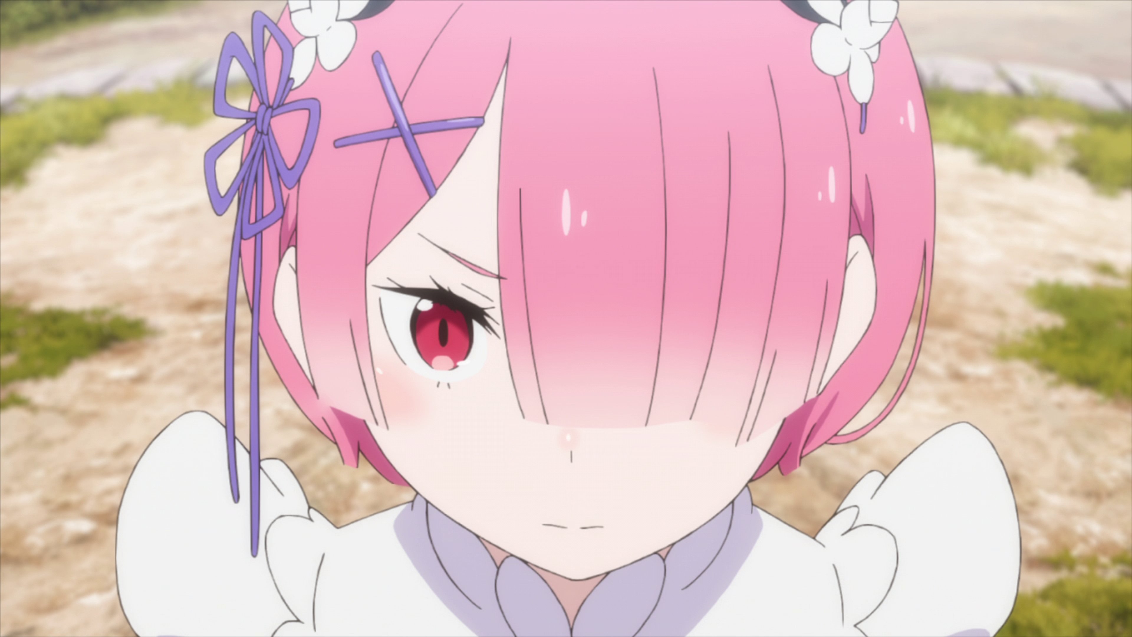 A young woman with pink hair in a maid uniform