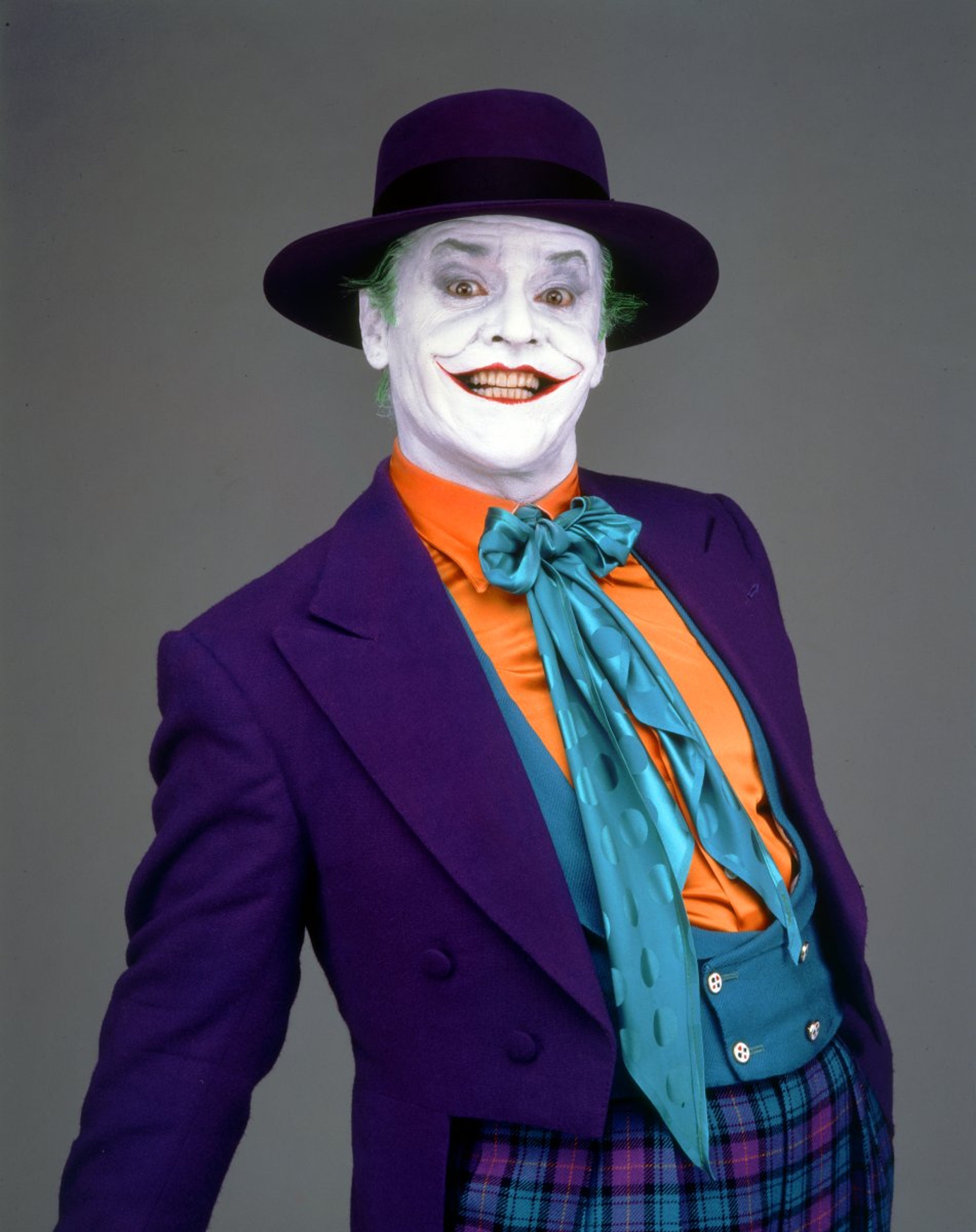 The Joker, a fictional character with chalk-white skin, green hair, and a permanent grin.