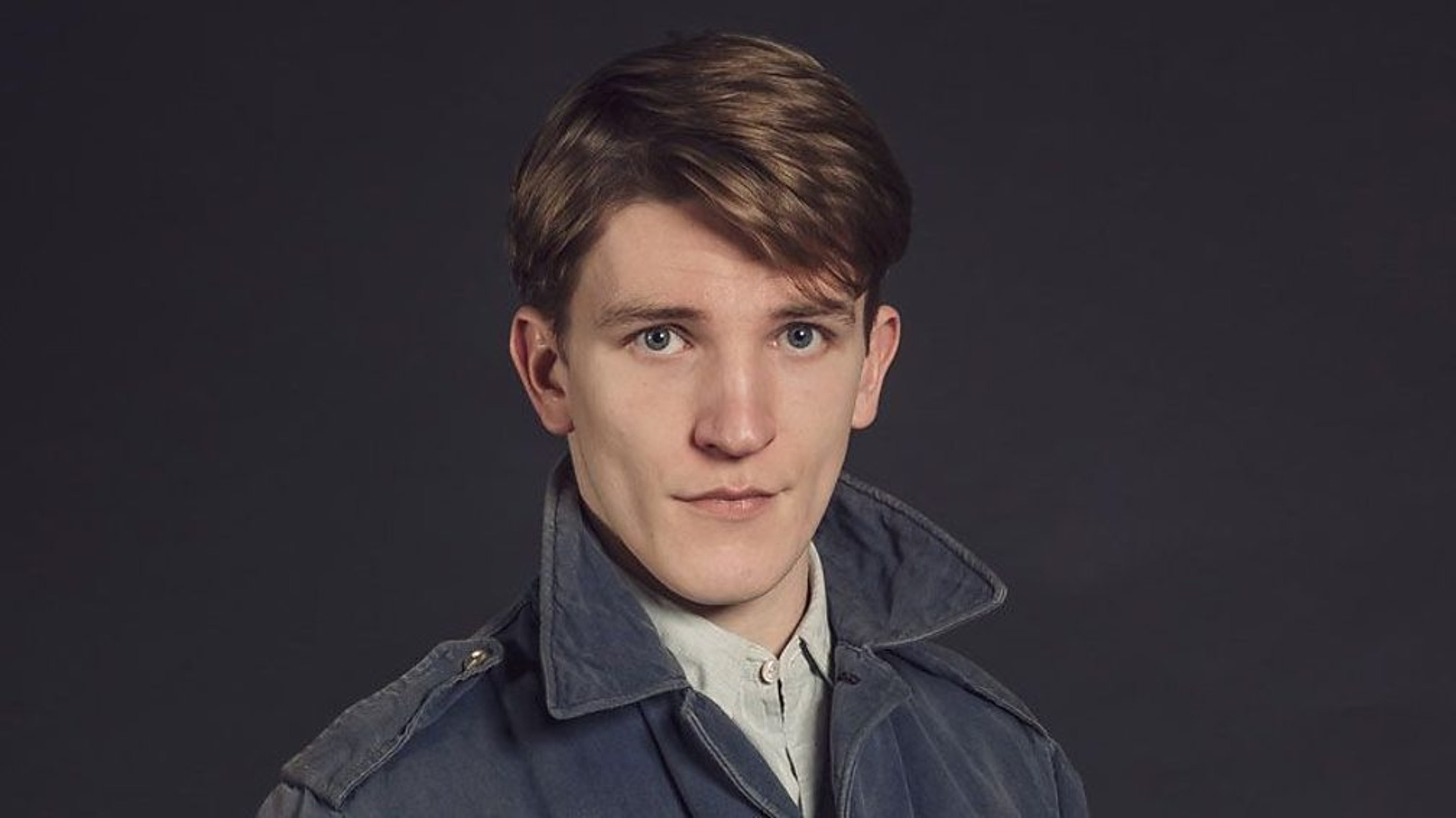 A young man in a British Royal Navy uniform