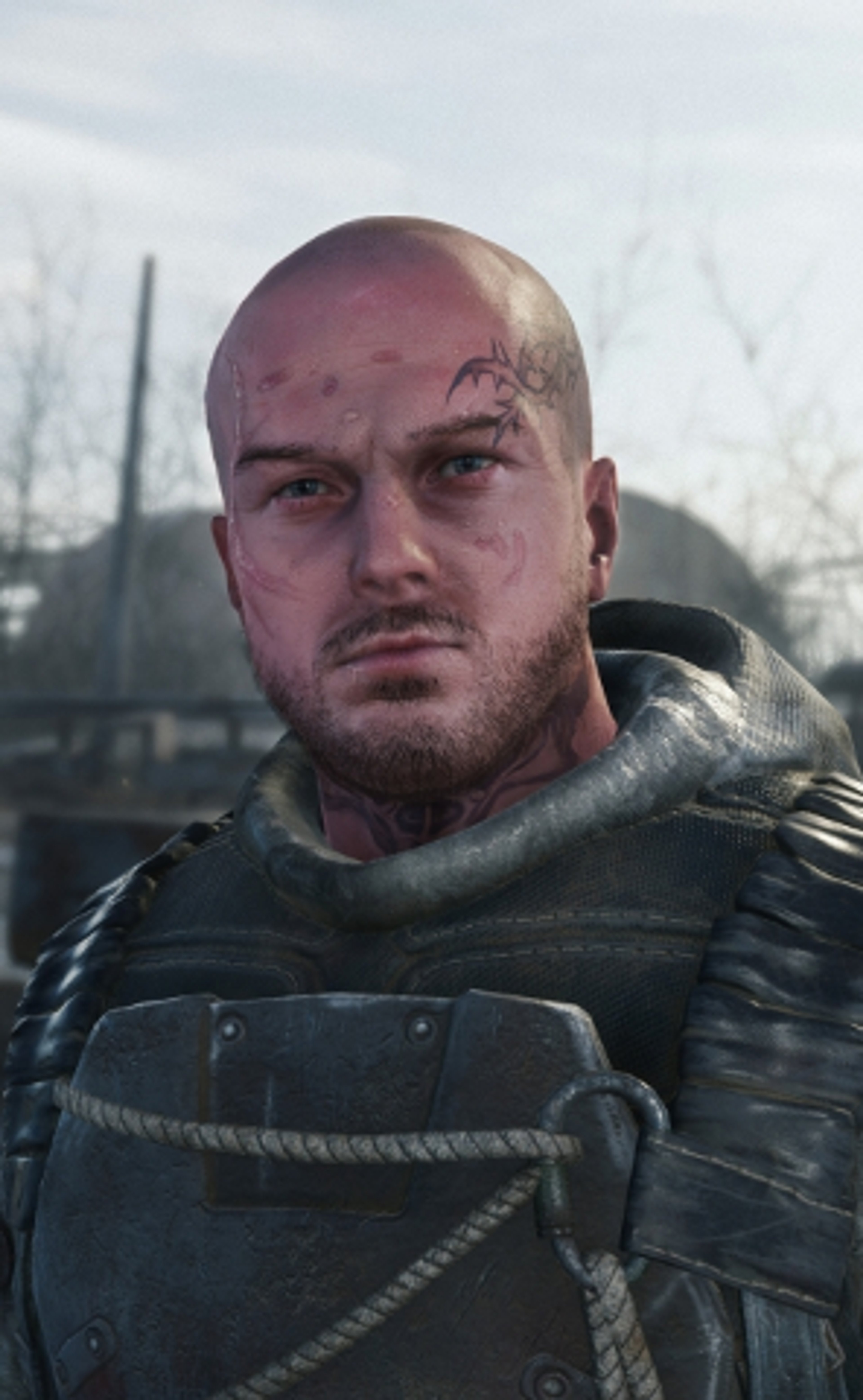A bald, middle-aged man with a weathered face and a tattoo, wearing a dark jacket in a post-apocalyptic setting.