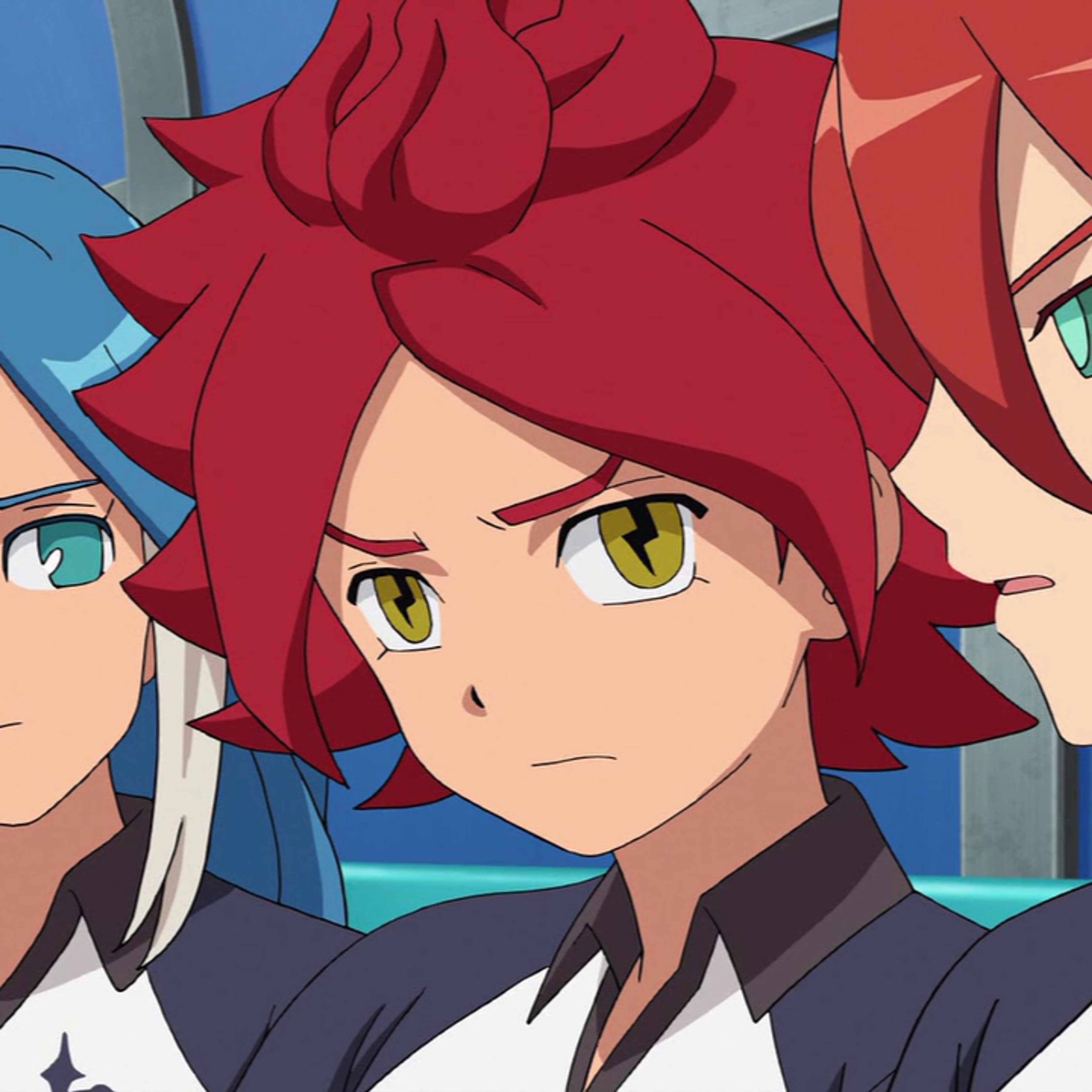 An anime-style character with red spiky hair and golden eyes, wearing a black and red soccer uniform