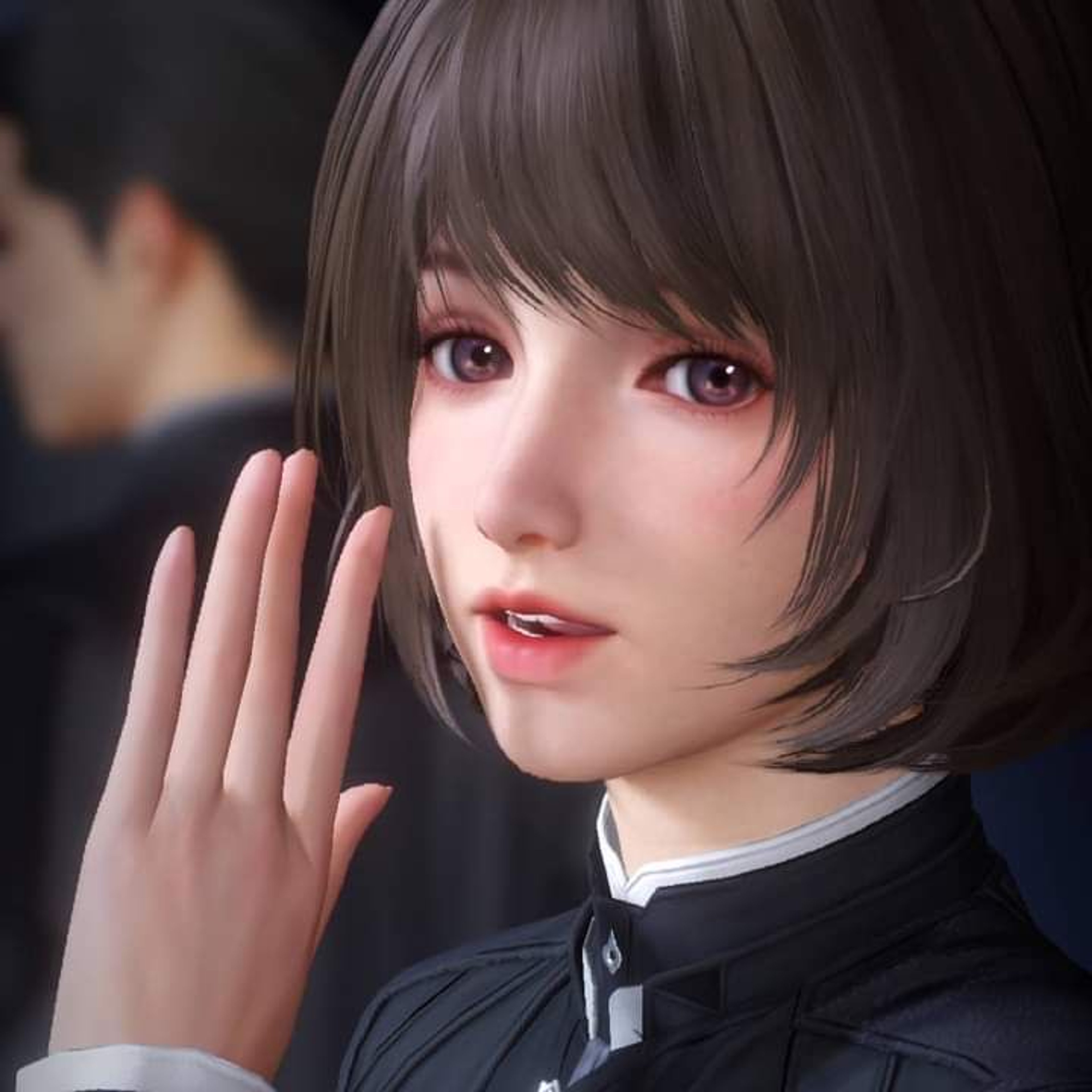 A young woman with short dark hair and a serious expression, wearing a black outfit and gesturing with her hand.