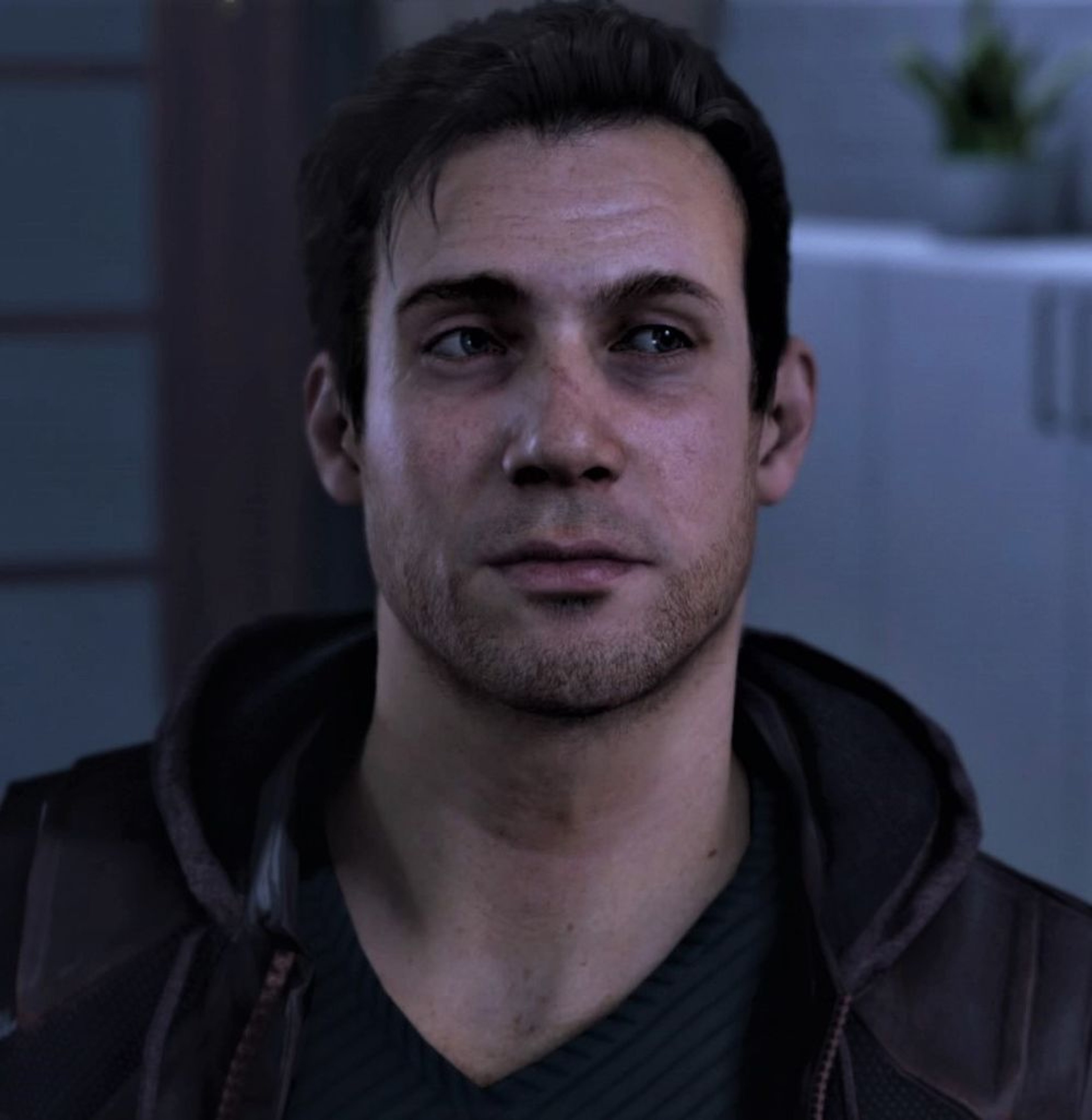A middle-aged man with short dark hair wearing a black jacket, appearing to be a police officer or detective.