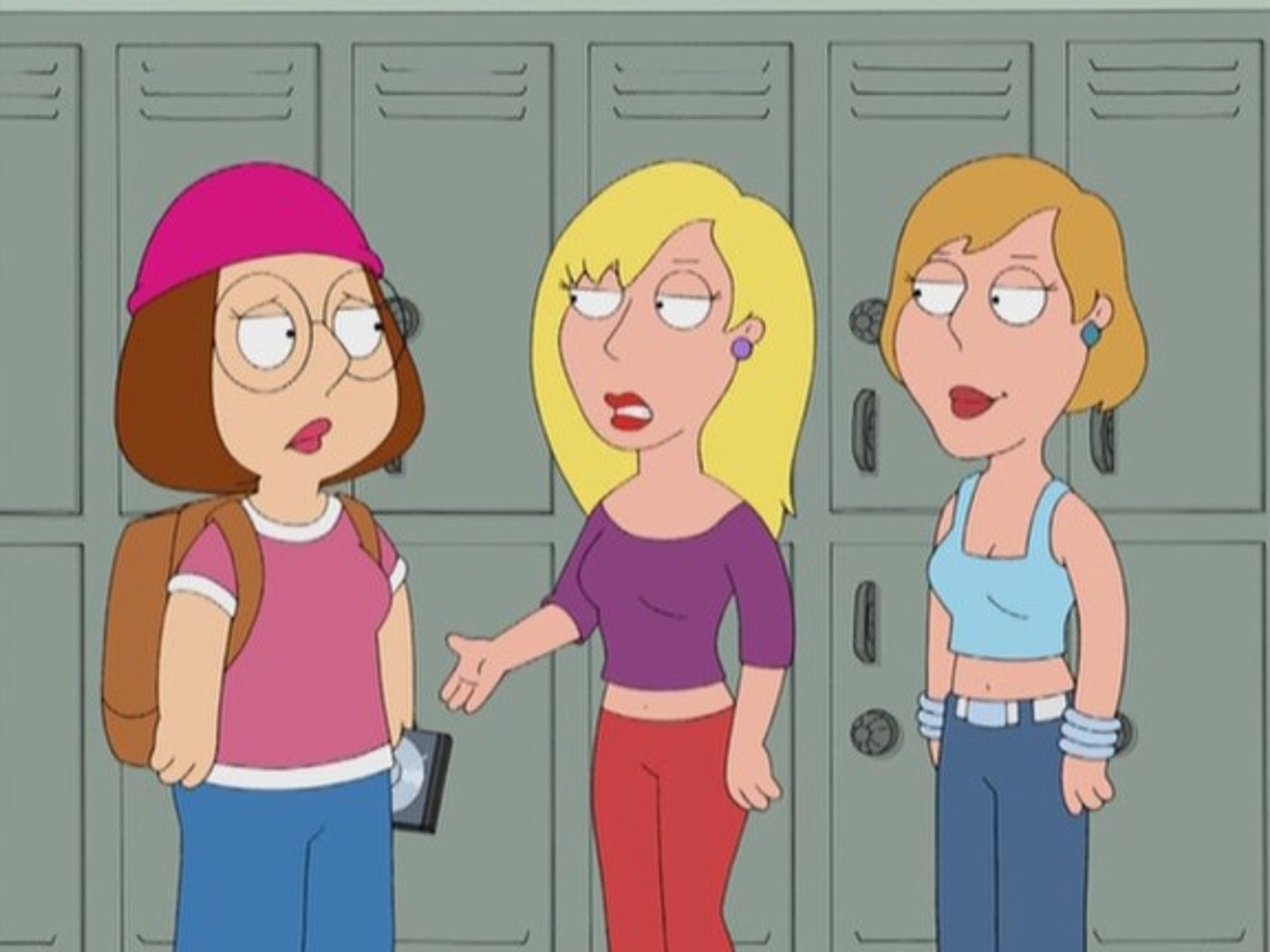 Three teenage girls standing in front of school lockers