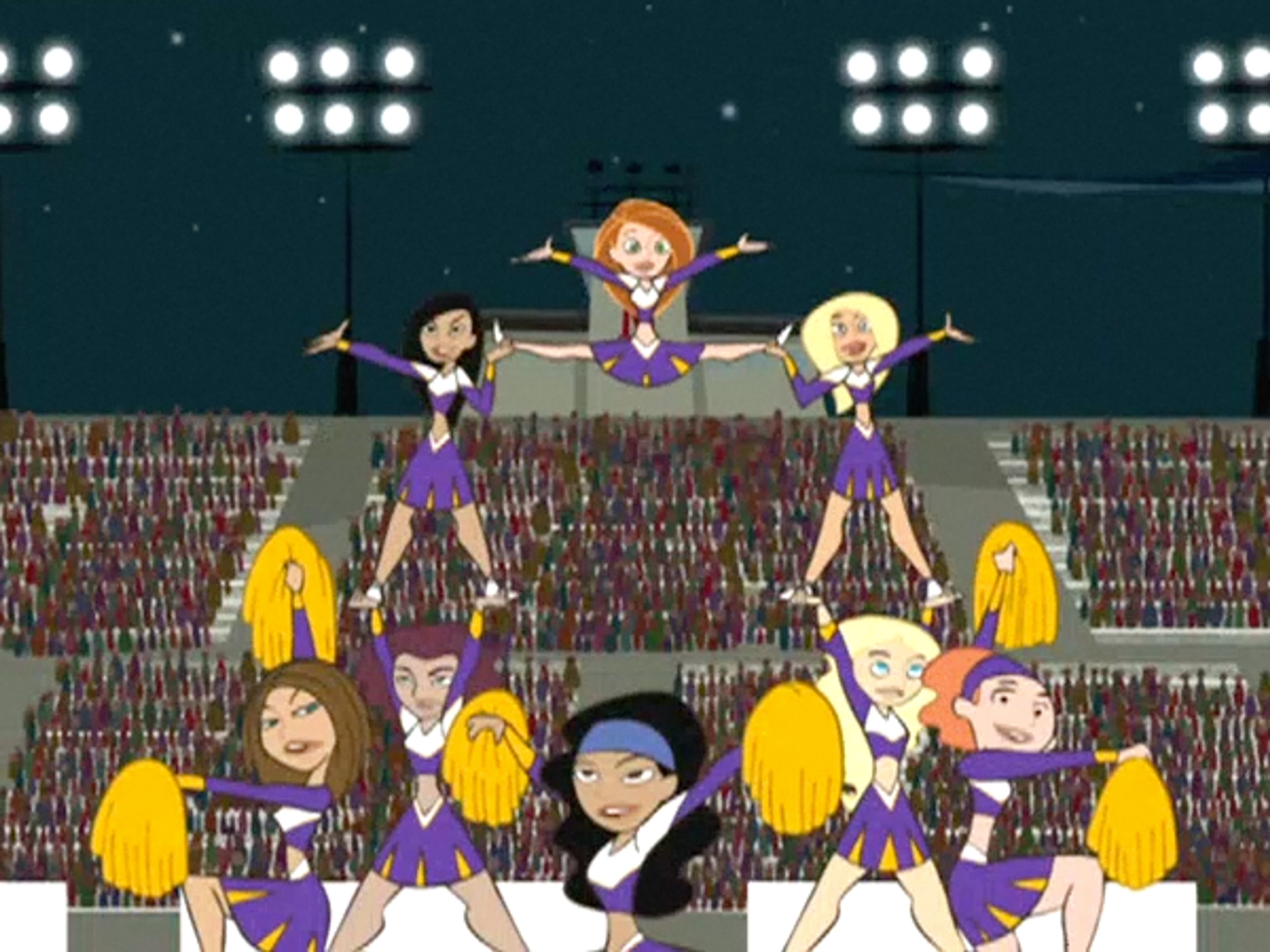 A group of cheerleaders performing on a stage