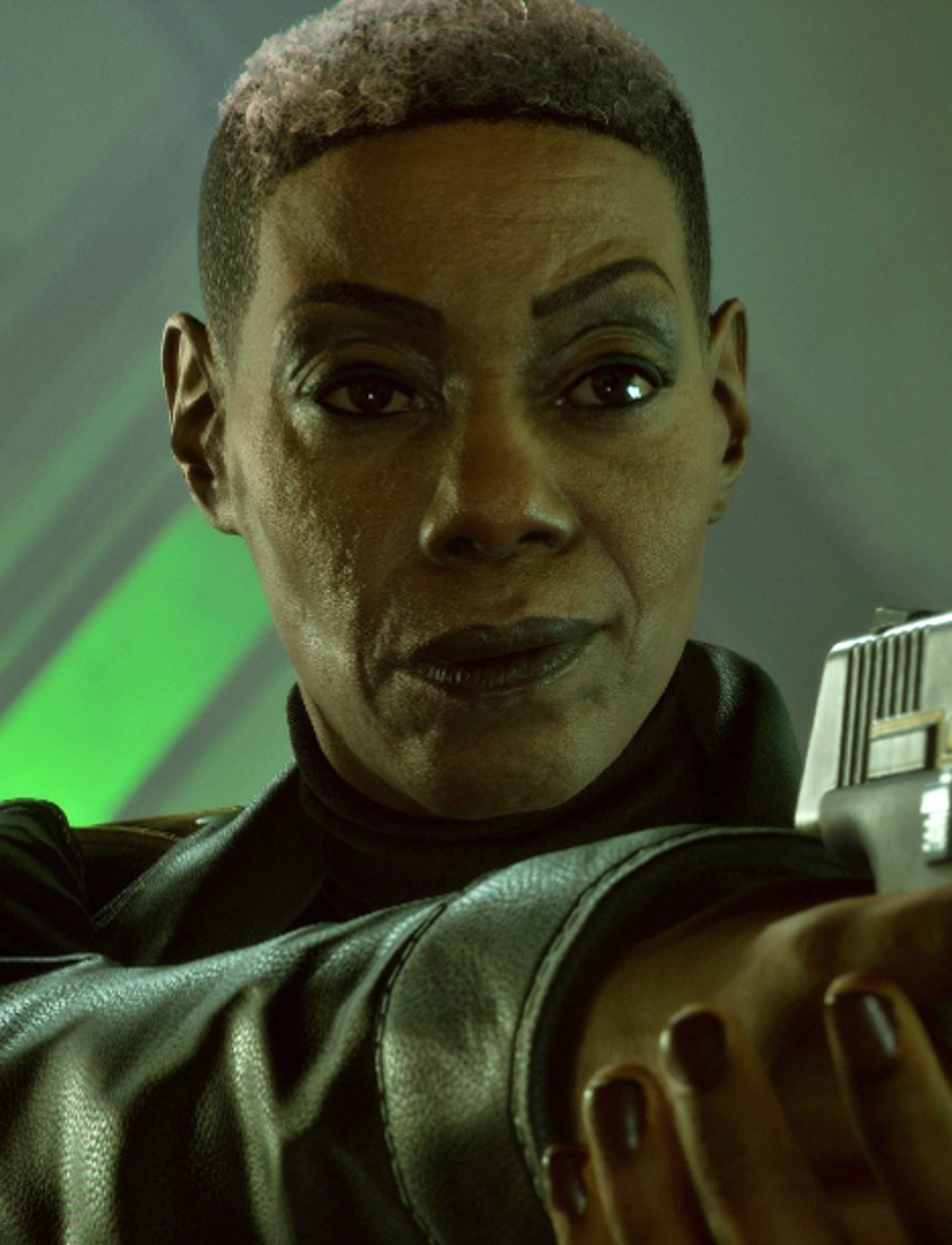 A serious-looking African American woman in a black leather jacket