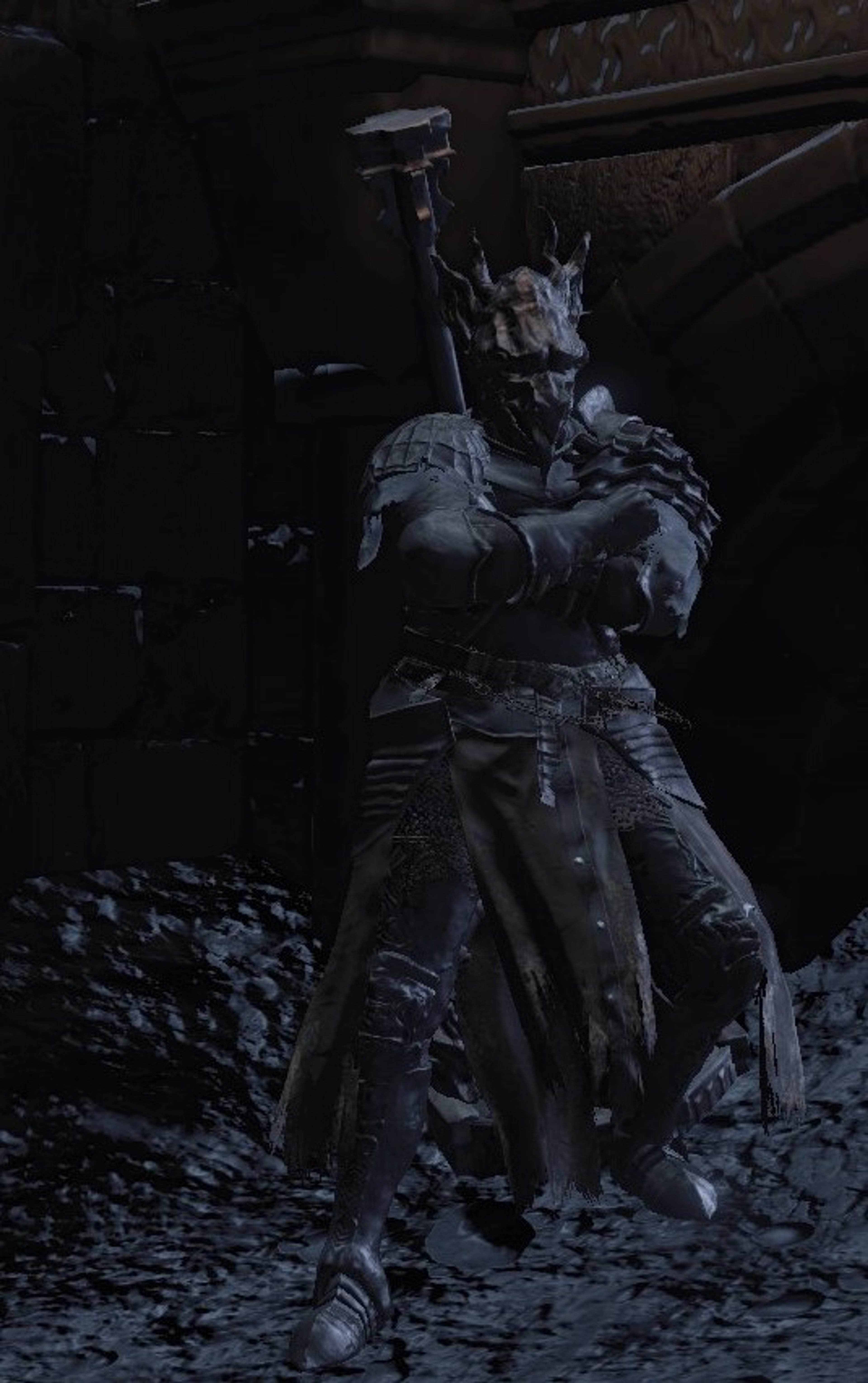 A dark, armored knight or warrior figure standing in a shadowy, atmospheric environment.