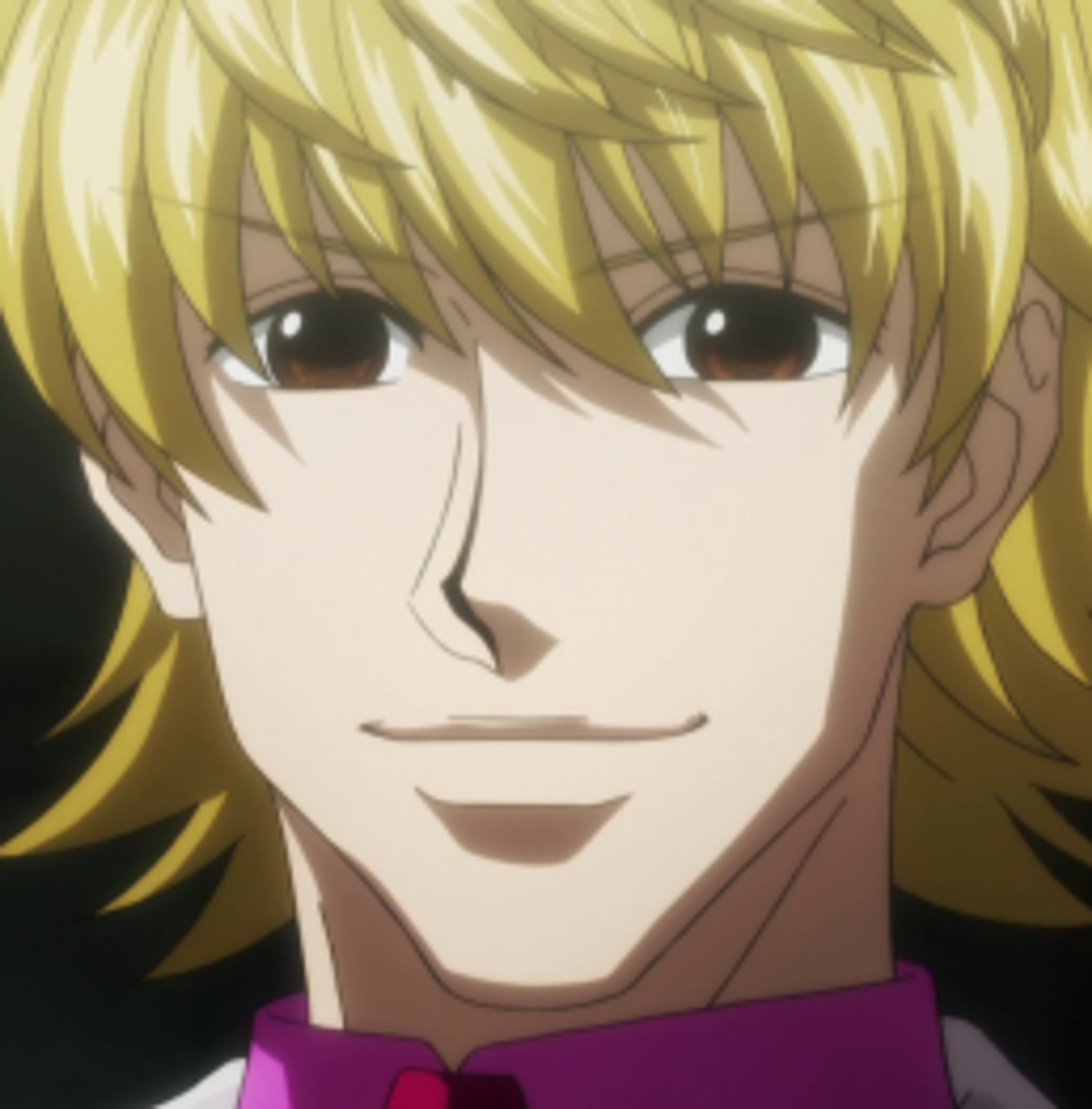 A man with blond hair and a cheerful expression, dressed in a suit and tie.