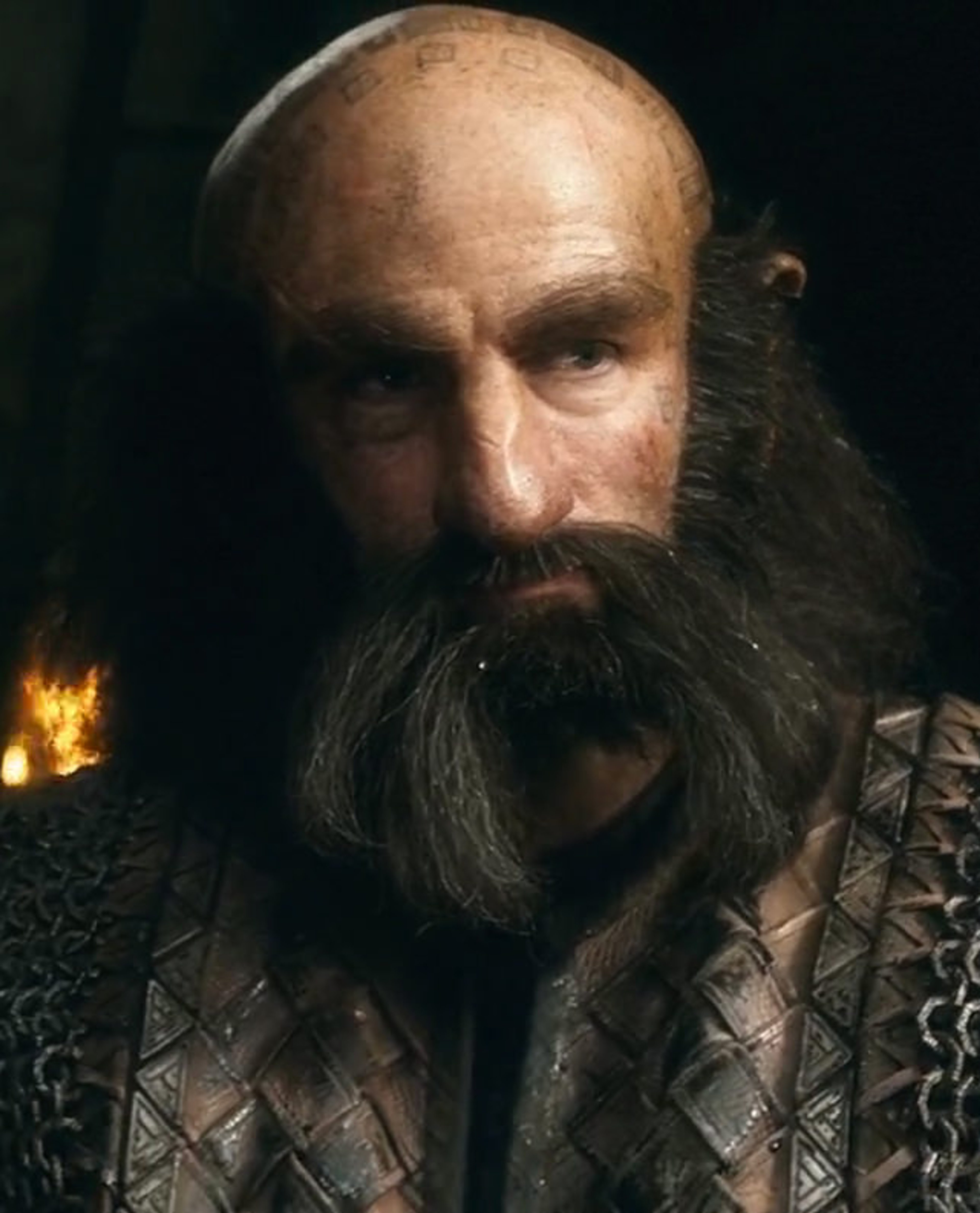 A close-up portrait of a gruff, battle-hardened dwarf warrior with a thick beard and stern expression.